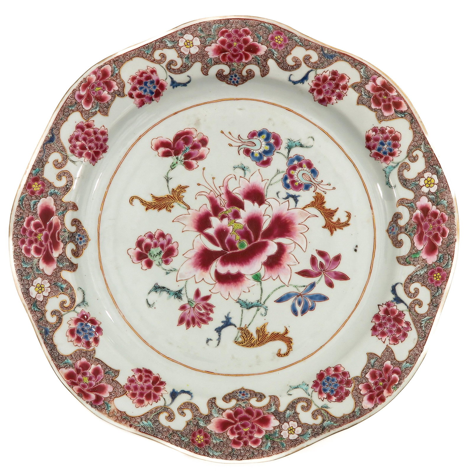 A Famille Rose Charger: Floral decor in Famille Rose enamels with gilt accents, 18th Century, 37 cm. in diameter, chip.