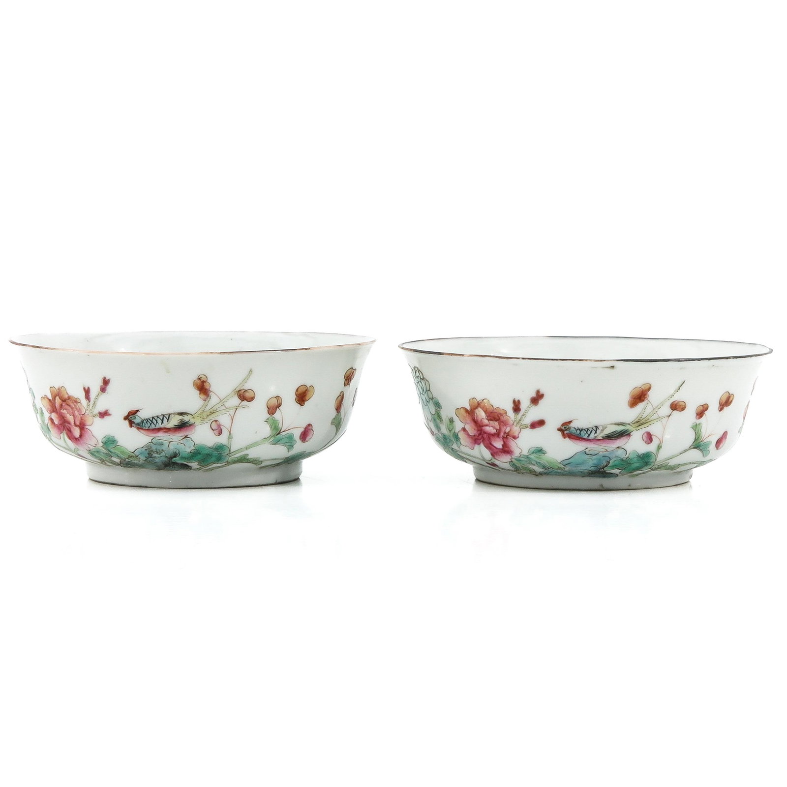 A Pair of Famille Rose Bowls: Decorated with flowers and birds, 12 cm. in diameter.