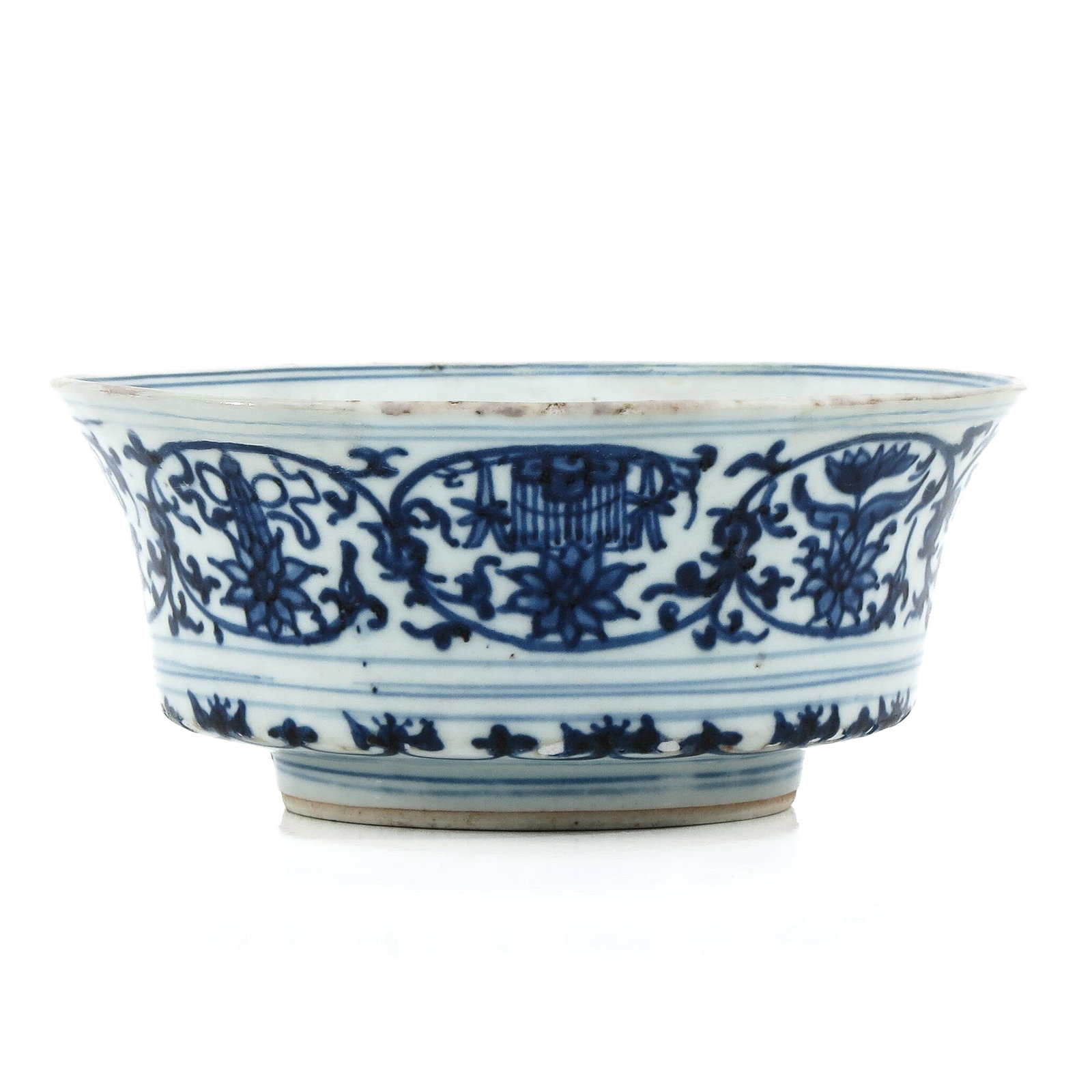 A Blue and White Bowl: Floral decor, Xuande mark, Kangxi Period, 17 cm. in diameter x 7 cm. tall, restored.