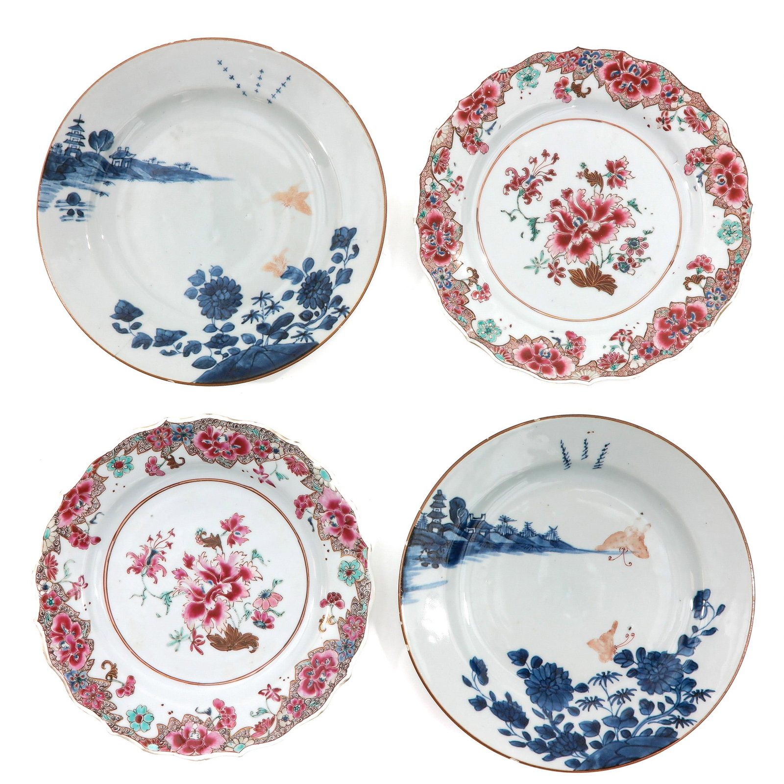 A Collection of 4 Plates: Including a pair of Famille Rose plates and a pair of blue and white plates with iron red decor of butterflies in landscape, 23 cm. in diameter, chip and hairline.