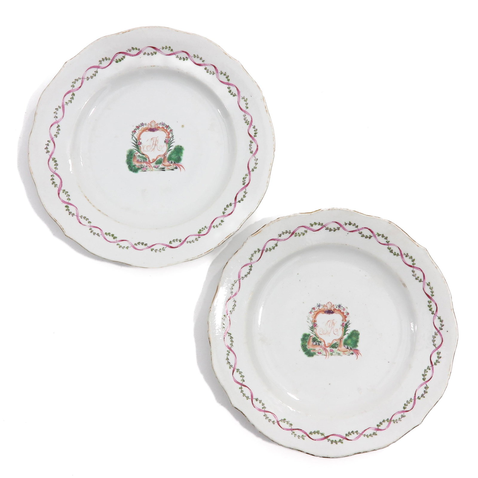 A Pair of Famille Rose Armorial Plates: Decorated with crest in center of dish with pheasants and monogram, 23 cm. in diameter, in diverse conditions.
