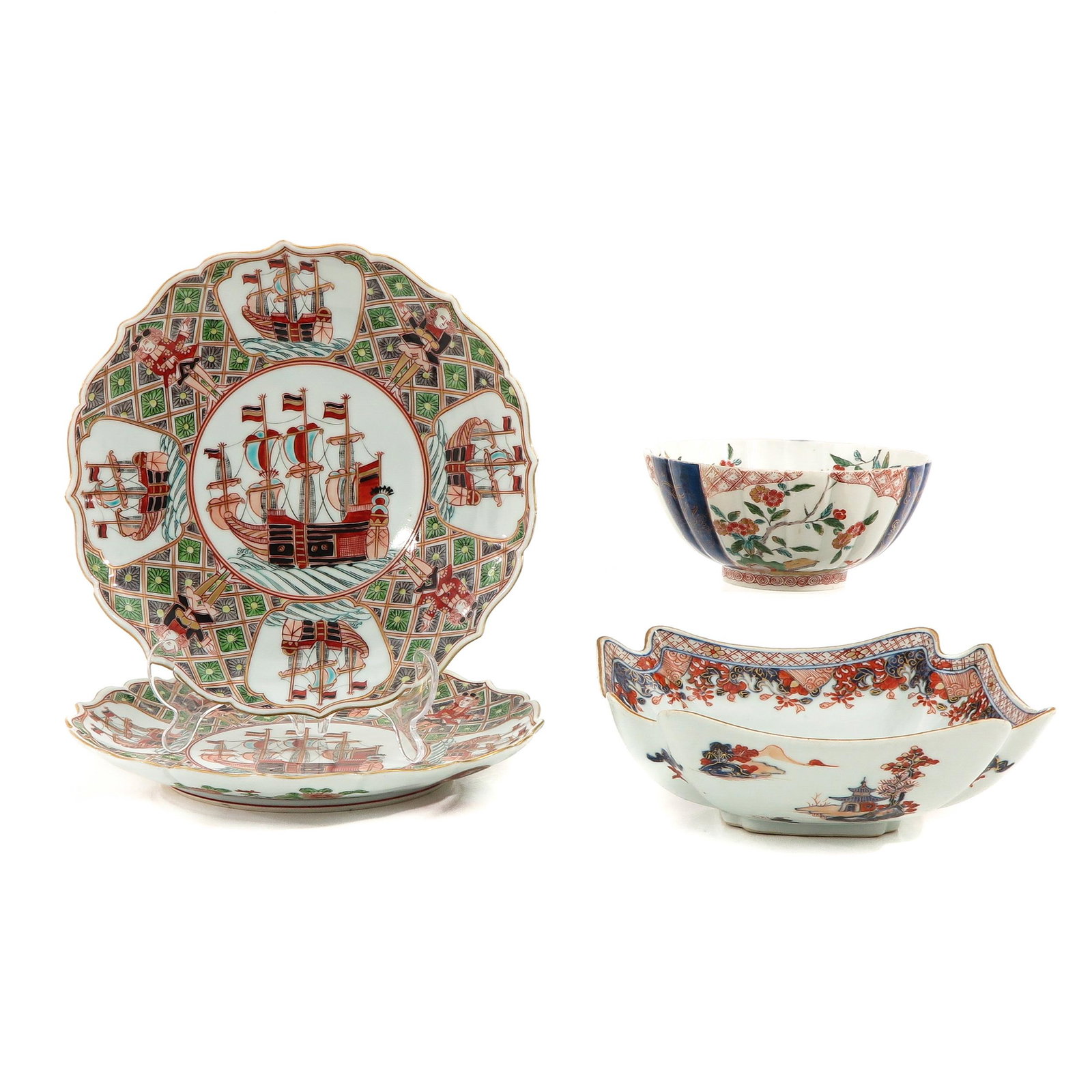 A Collection of Japanese Porcelain: Including 2 plates and 2 serving bowls, in a variety of decors, plates are 26 cm. in diameter, in diverse conditions.