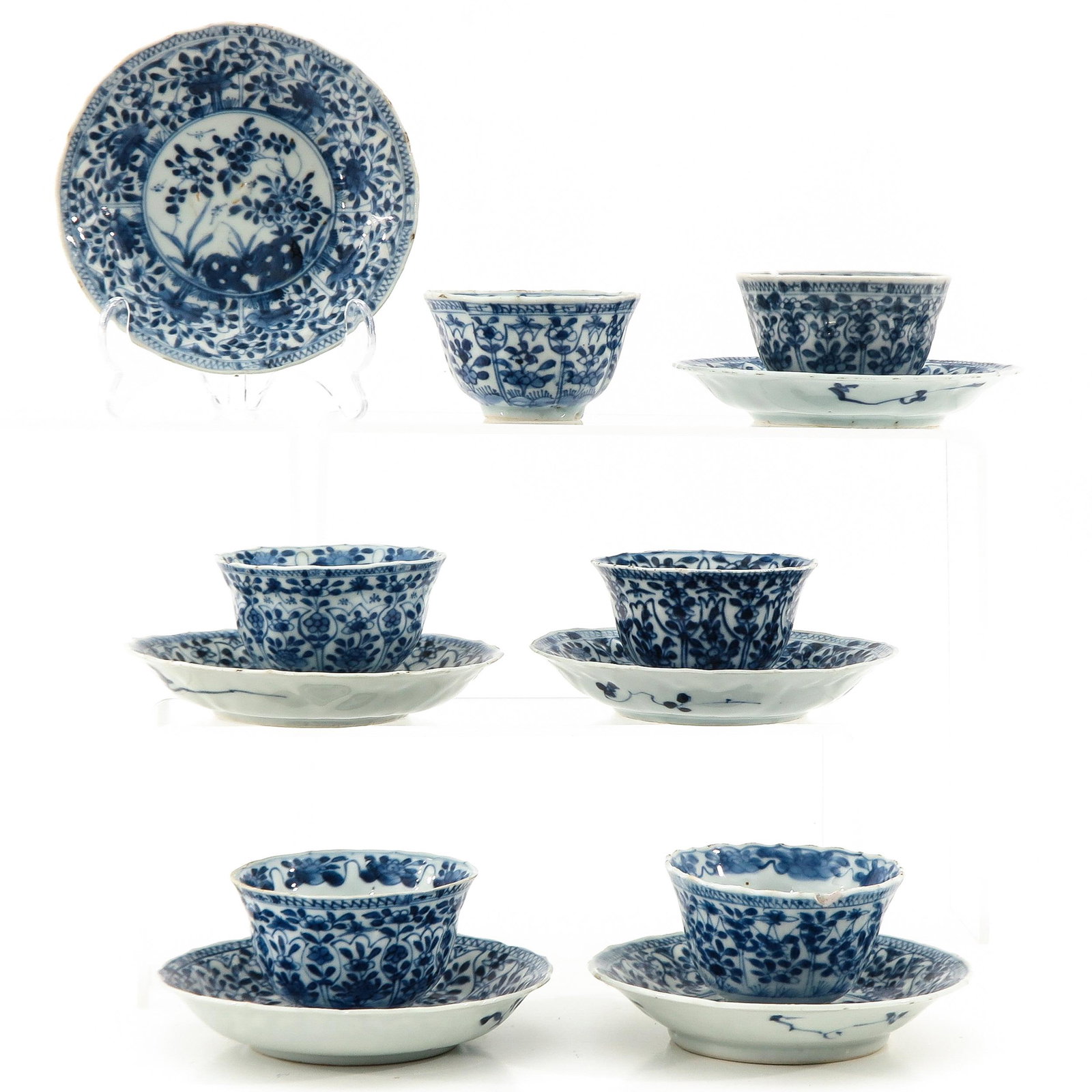 A Collection of Cups and Saucers: Including 6 cups and 6 saucers, largest saucer is 14 cm. in diameter, chip and hairline.