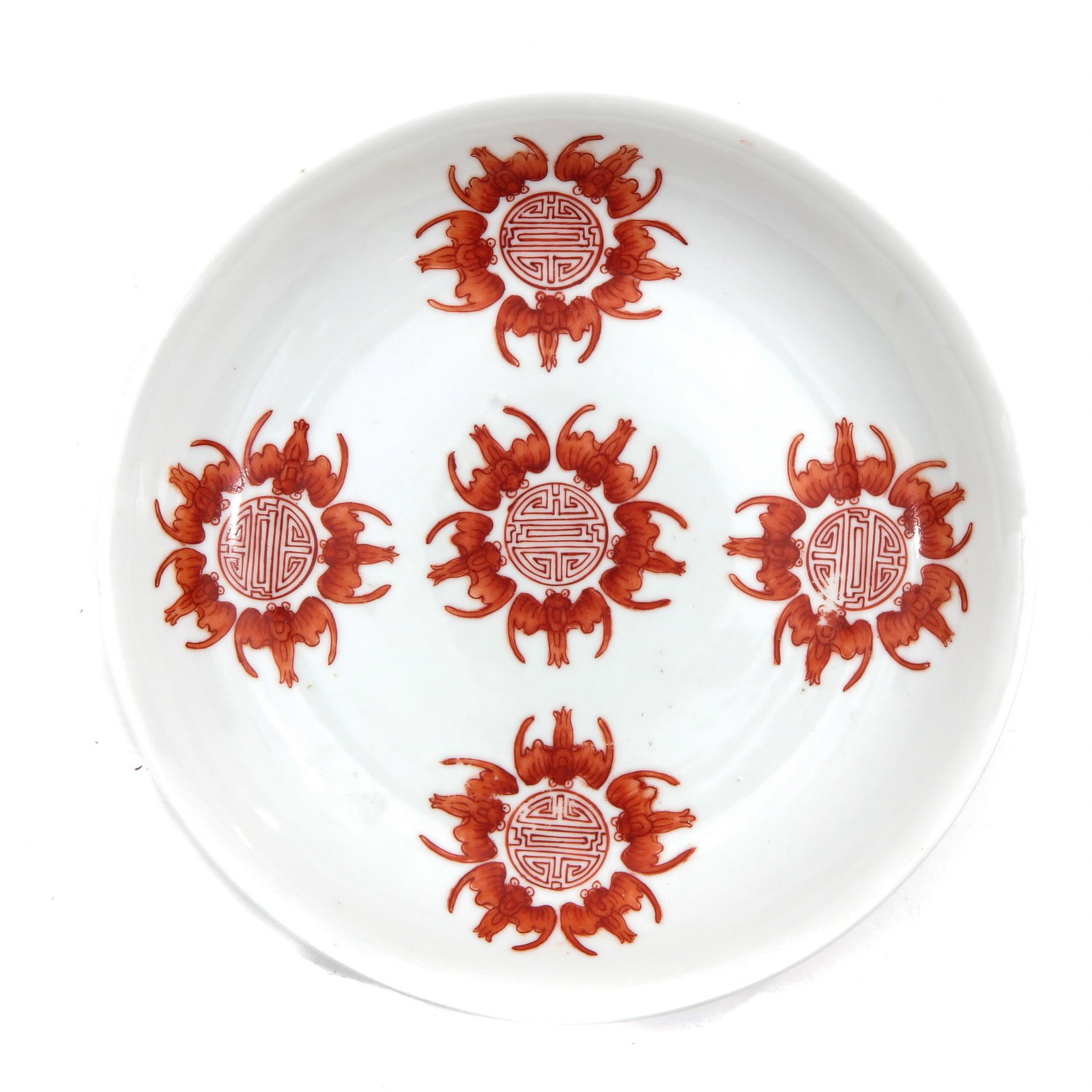 A Five Bat Decor Plate: Depicting 5 bats surrounding Shou characters in iron red decor, Guangxu mark, 18 cm. in diameter.