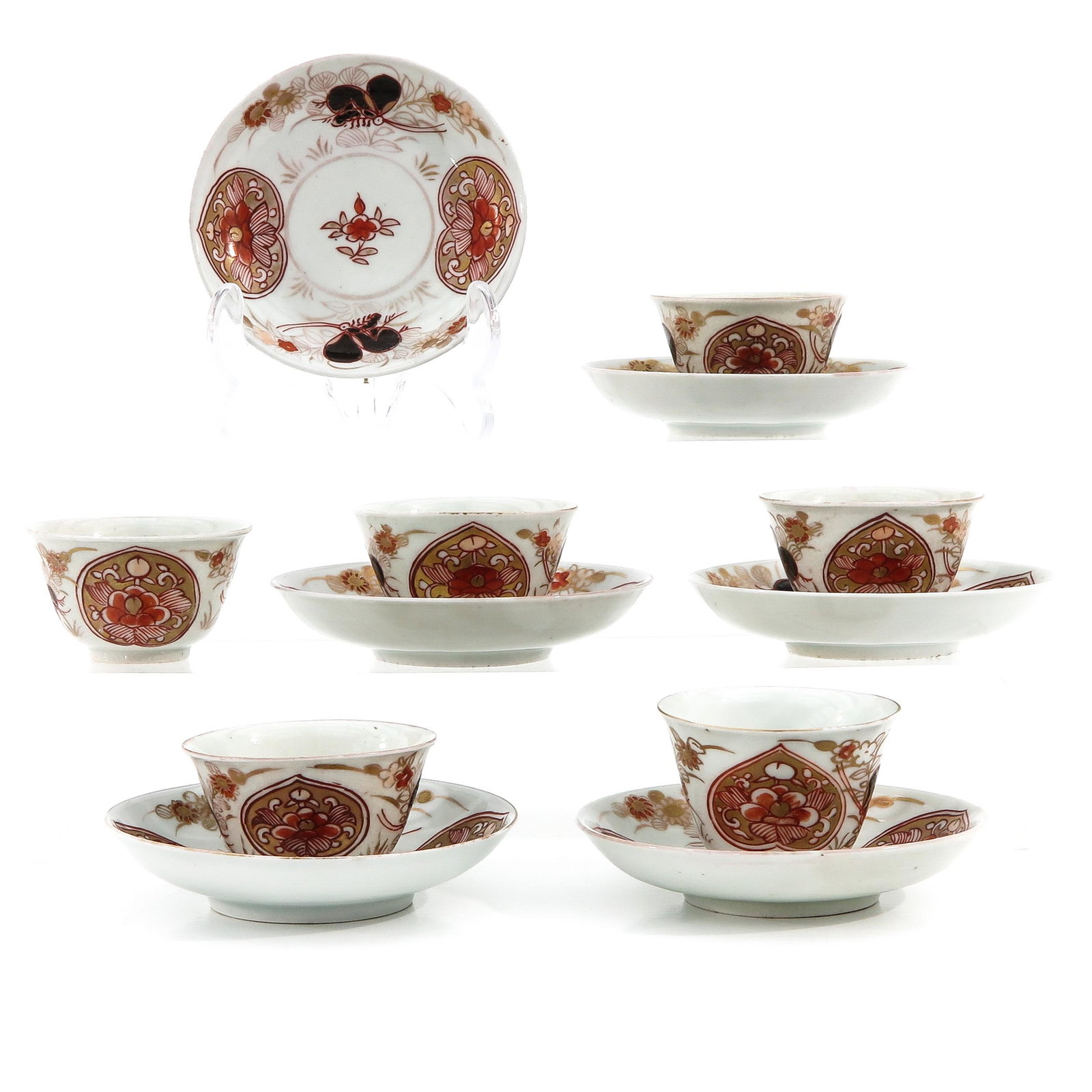 A Series of 6 Cups and Saucers: In iron red, blue and gilt floral decor, saucers are 10 cm. in diameter, hairline.