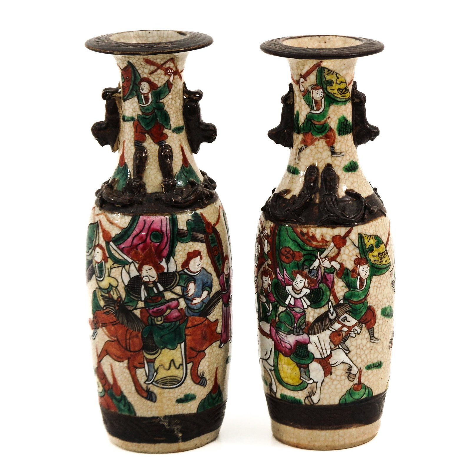 A Pair of Nanking Vases: Decorated with Chinese warriors on horseback, 30 cm. tall.