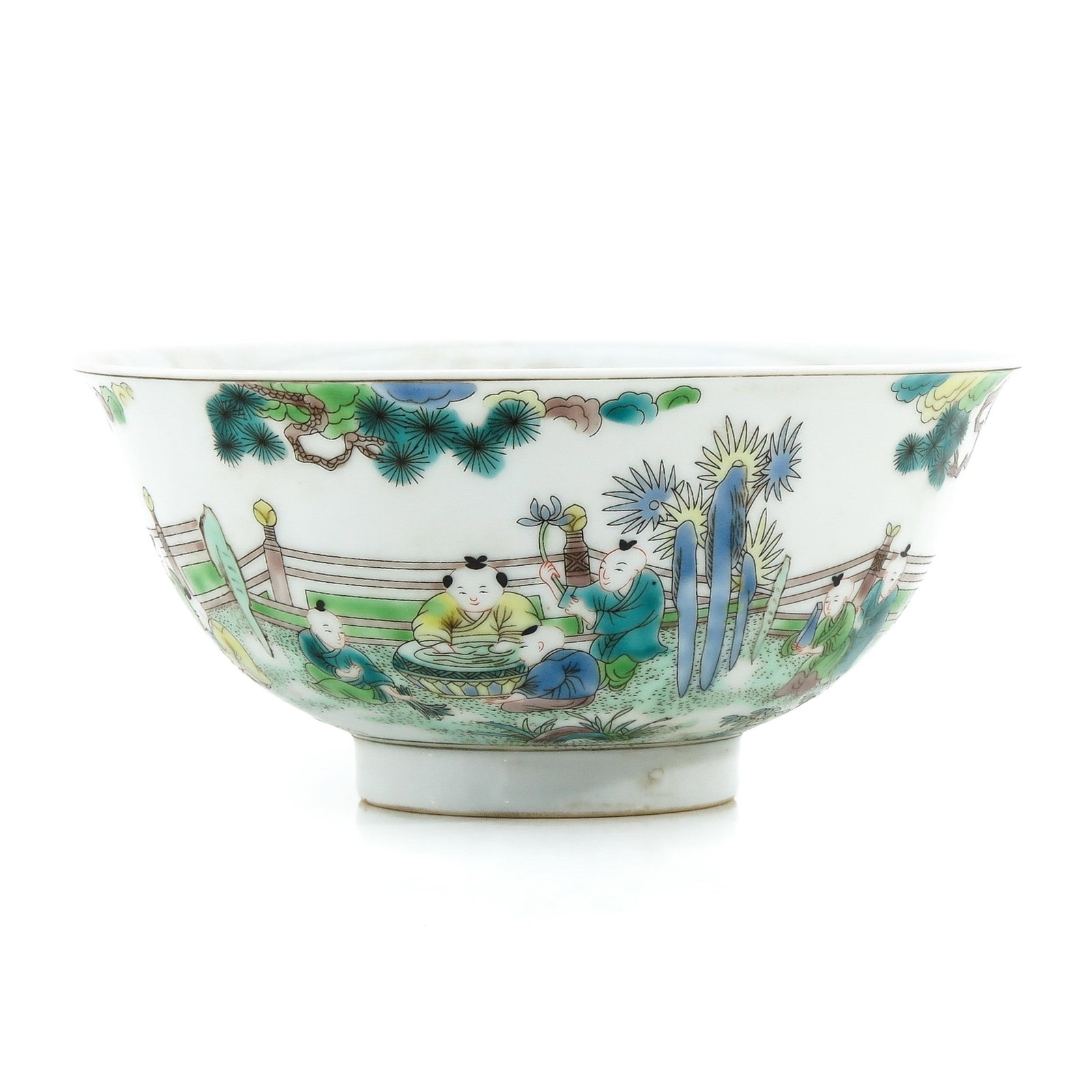 A Famille Verte Bowl: Depicting Chinese children in garden, Yongzheng mark, 16 cm. in diameter.