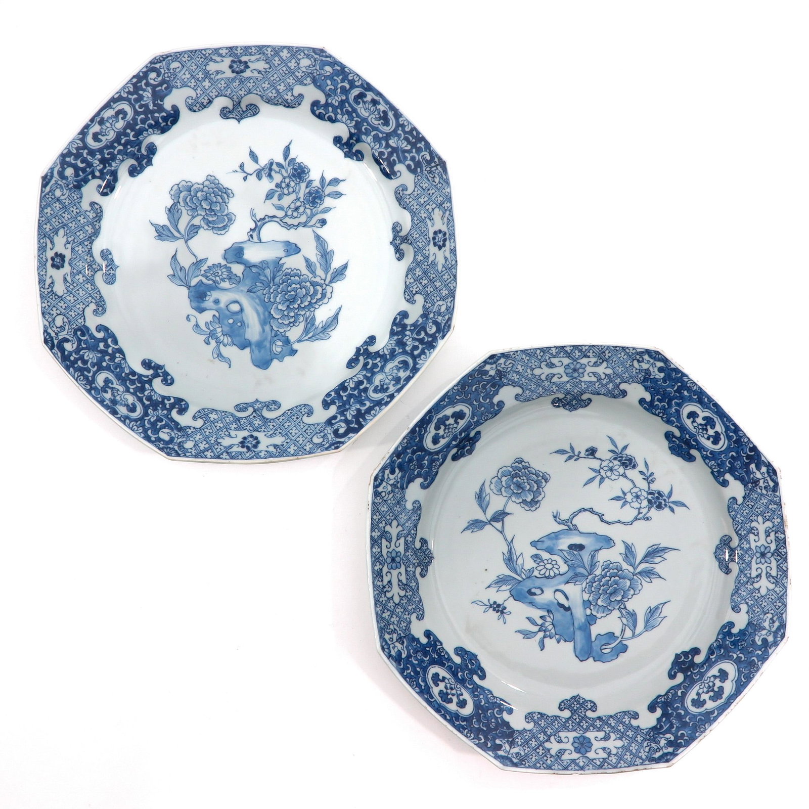 A Pair of Blue and White Sacred Fungus Plates: Octagonal shape, 33 cm. in diameter, chip.