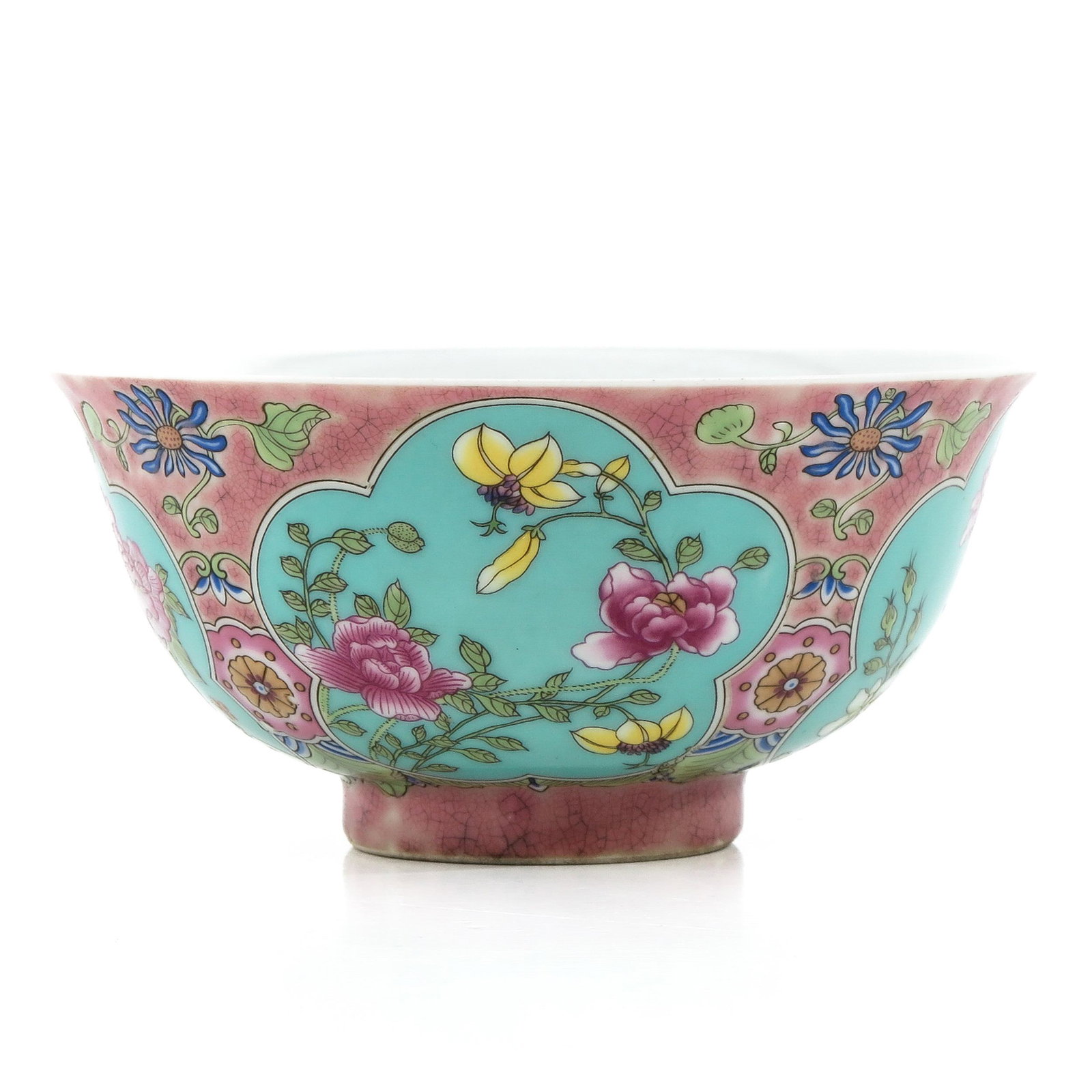 A Famille Rose Bowl: Pink and turqoise ground decorated with flowers in Famille Rose enamels, 15 cm. in diameter.