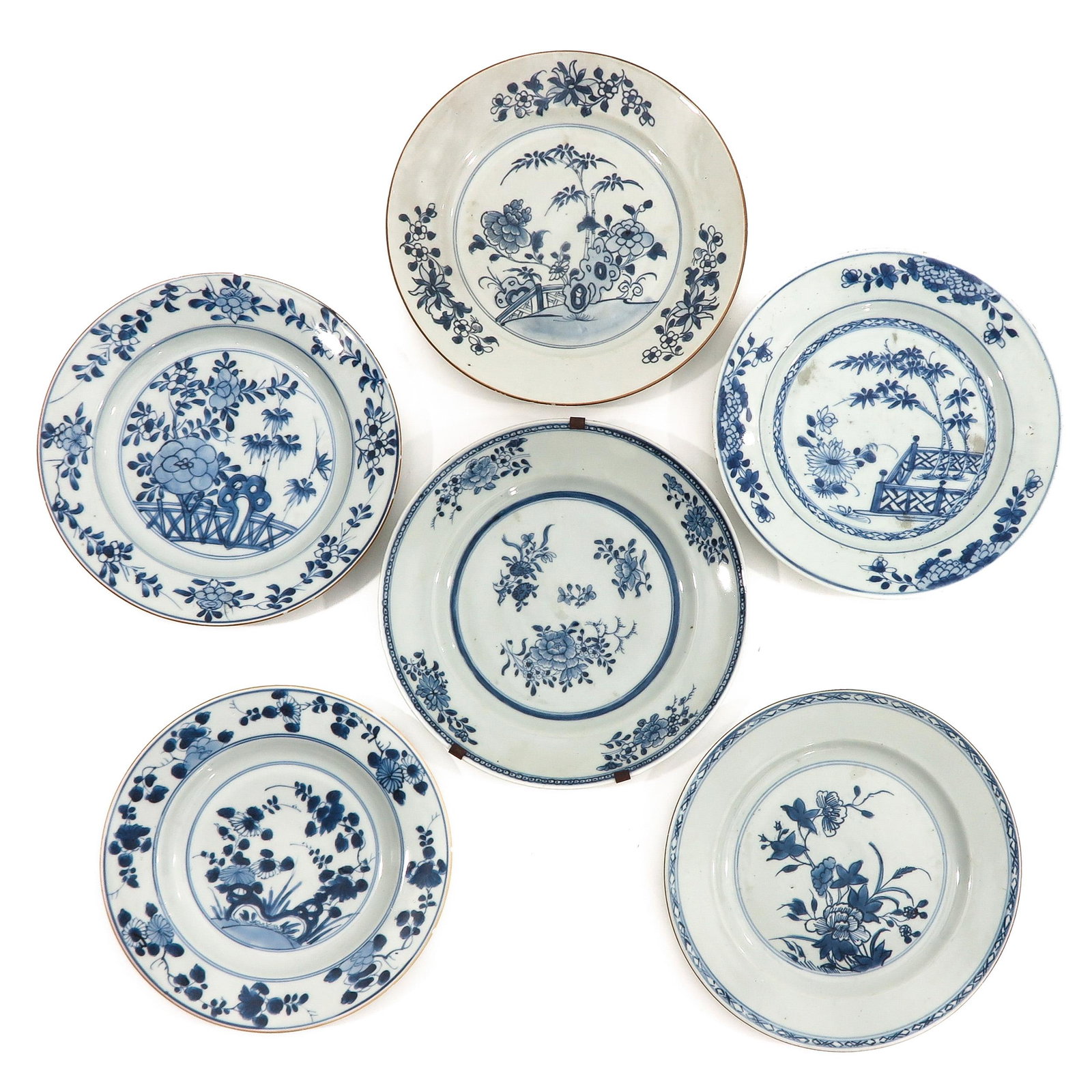A Collection of 6 Blue and White Plates: In a variety of blue and white decors and sizes, including 18th Century, largest plate is 23 cm. in diameter, chip and hairline