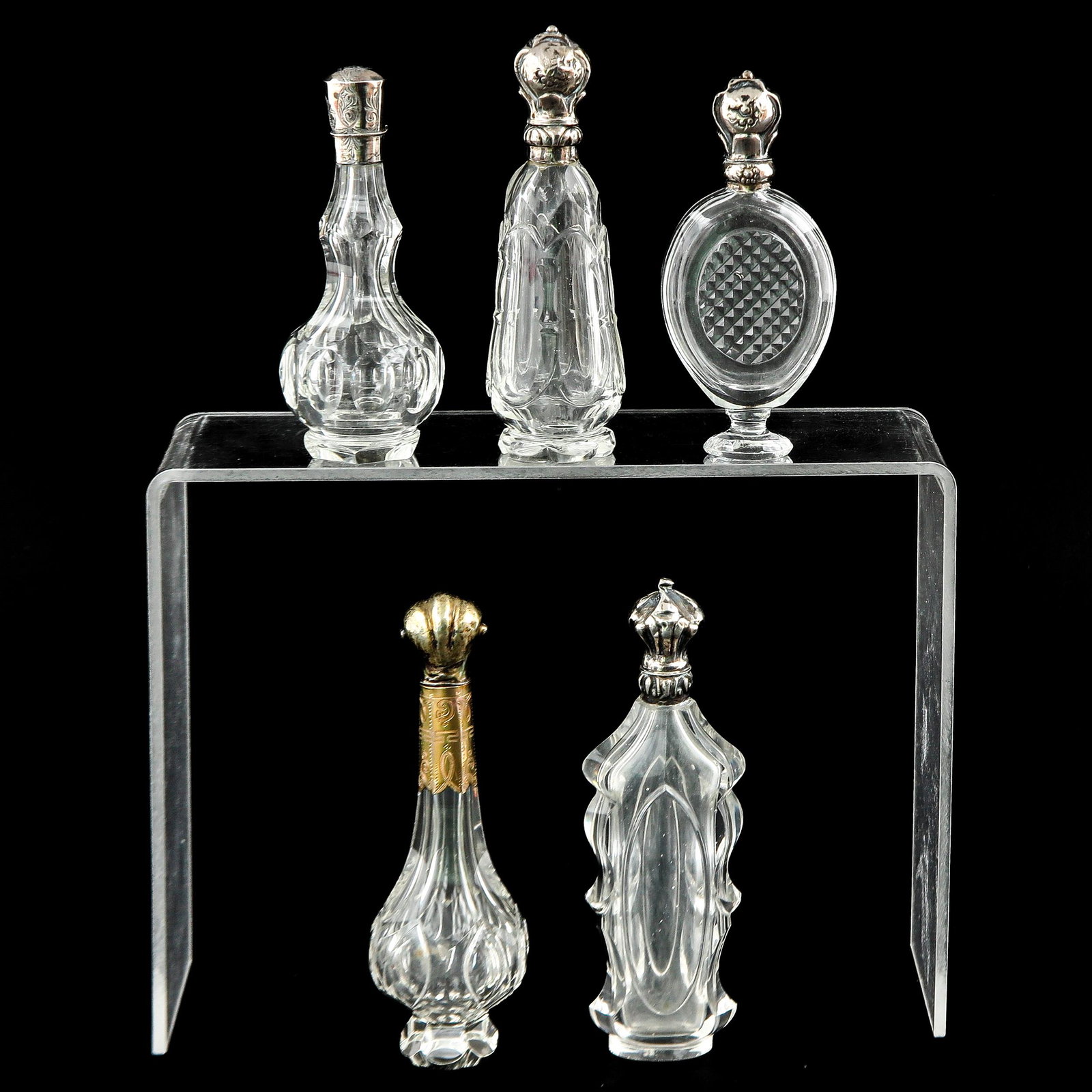 A Collection of 5 Perfume Bottles: Including silver and gold, tallest is 118 mm.