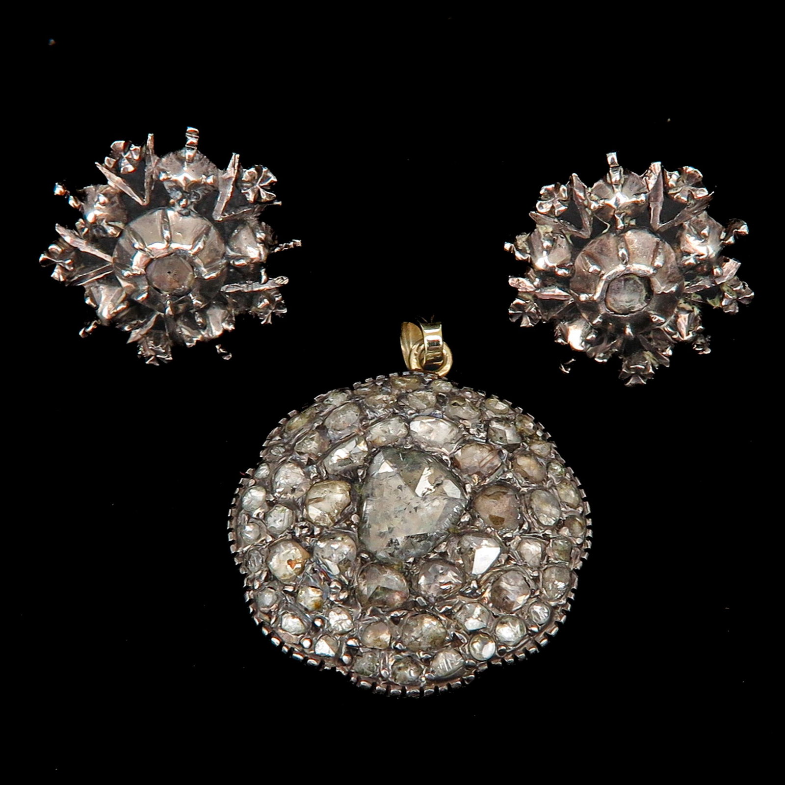 A Pair of Diamond Earrings and Pendant: European cut diamonds, 21 mm. in diameter each.