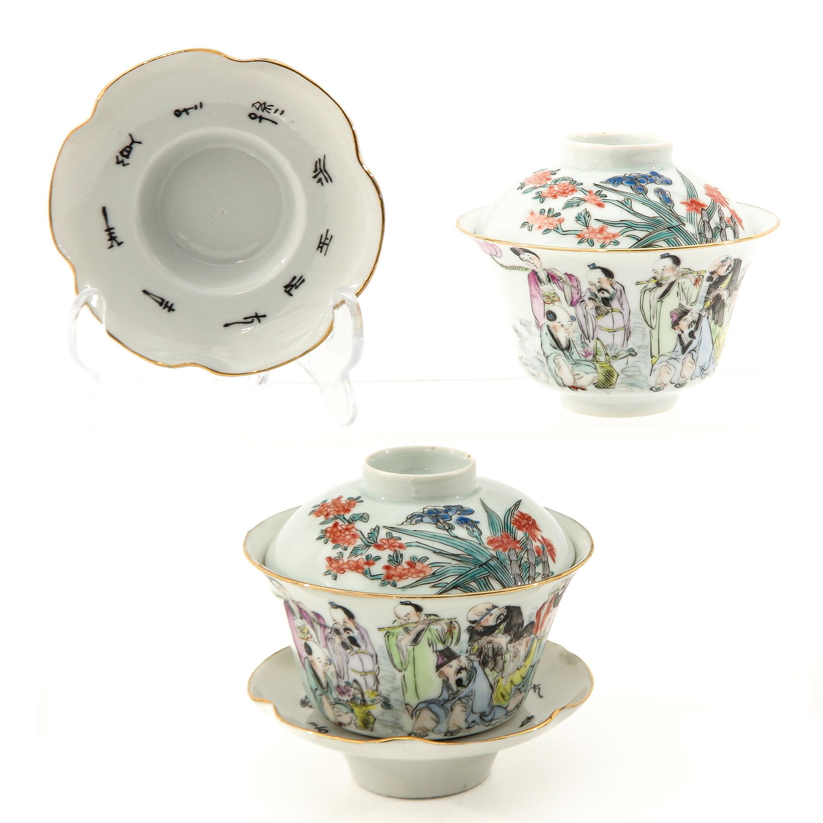 A Pair of Cups with Covers: Depicting gathering of Chinese figures, cups are 10 cm. in diameter, hairline.