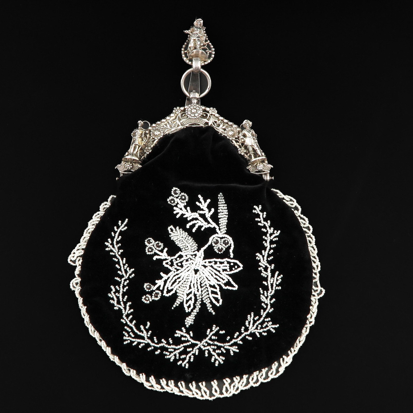 A West Friesland Silver Purse Frame and Hook: West Friesland, with rich silver bracket and hook, Amsterdam, 1832, master IS4, width bracket 16 cm.