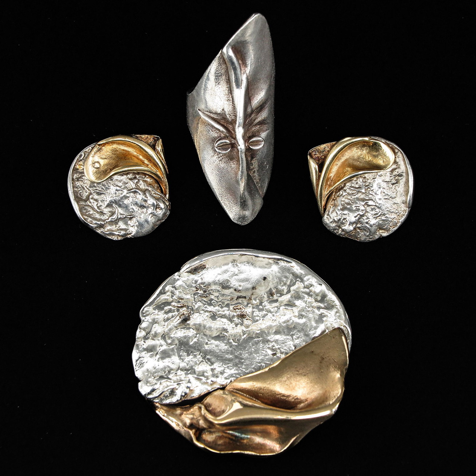 A Collection of Jewelry: 4 pieces, including Lapponia, silver, titled Mask of Gonda, by Bjorn Weckstrom, ring size 18.