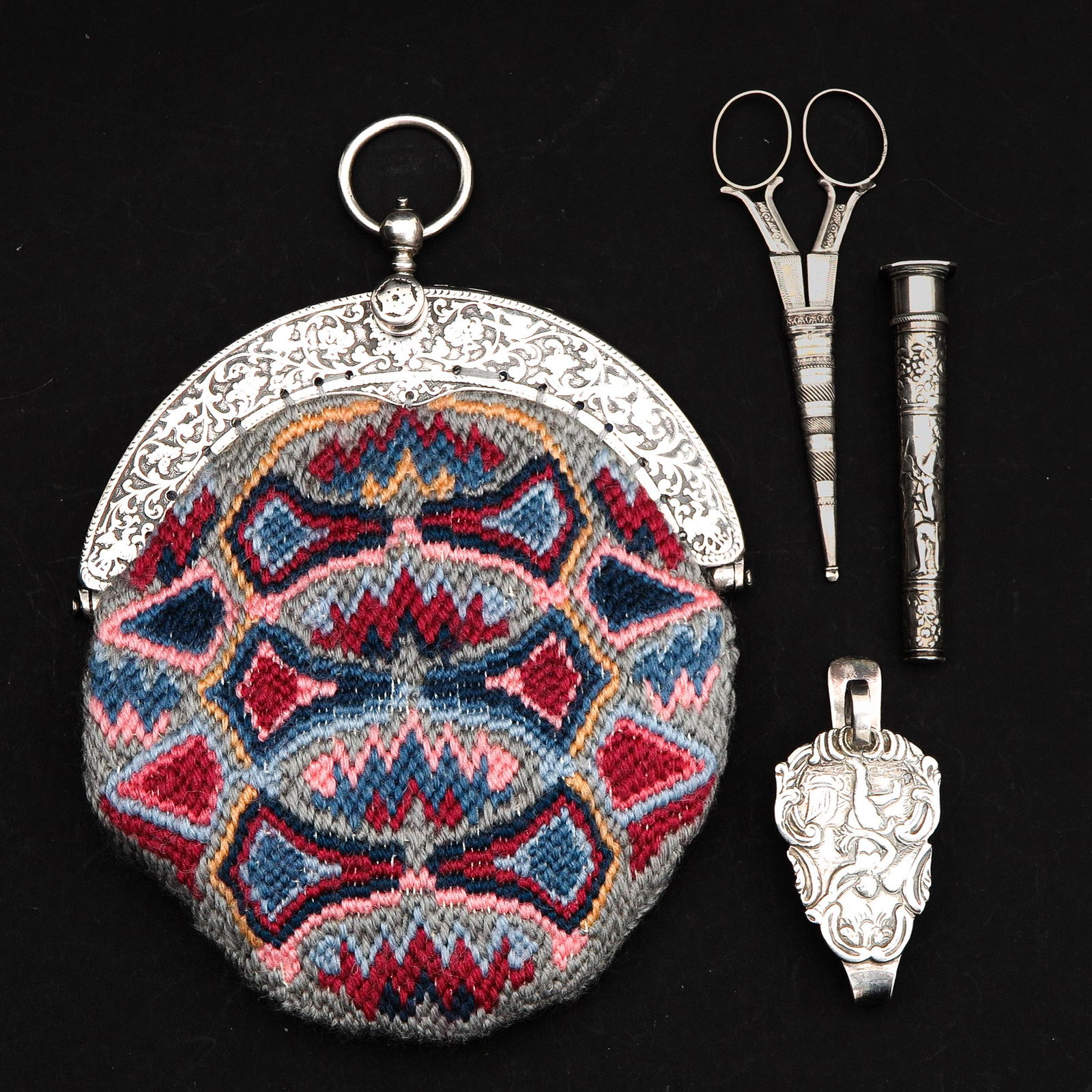 A Dutch Silver Frame Purse: Willem Wobbe, Amsterdam, 1718 - 1734, added scissors with sheath, needle case and silver bracket.