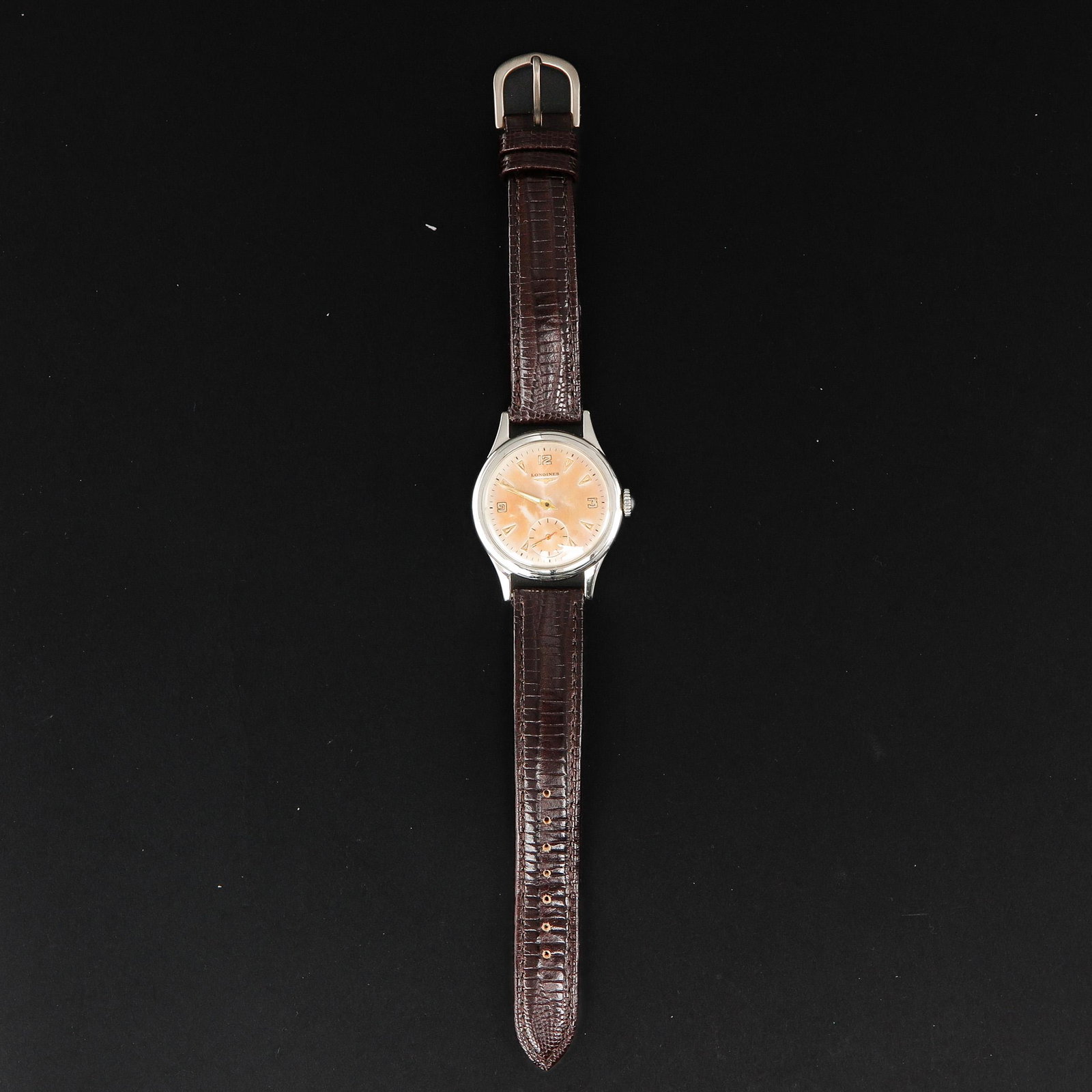 A Mens Longines Watch: On leather band, hand winder.