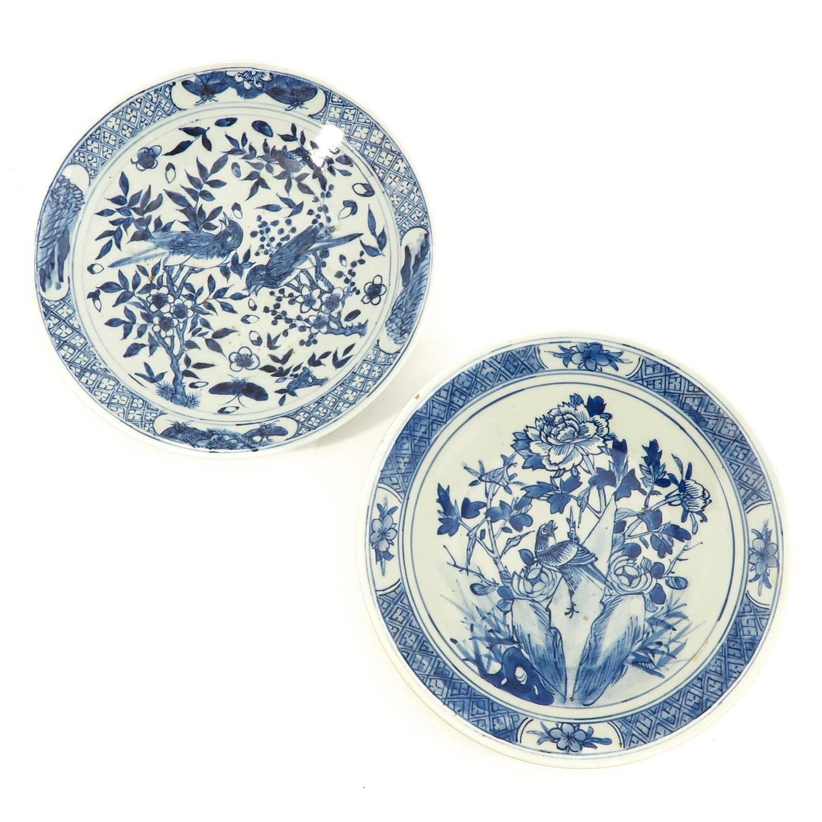A Lot of 2 Blue and White Chargers: Decorated with flowers and birds, largest plate is 31 cm. in diameter.