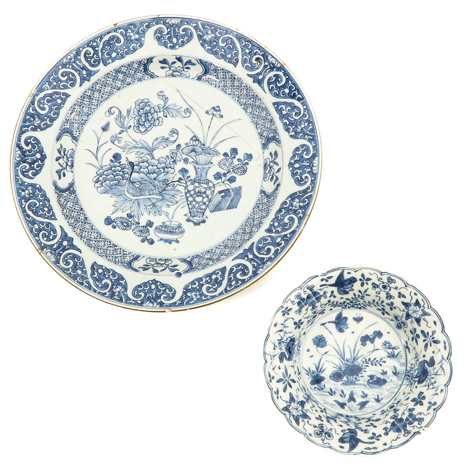 A Blue and White Charger and Plate: Floral decors, including 18th Century, including 18th Century, charger is 35 cm. in diameter, in diverse conditions.