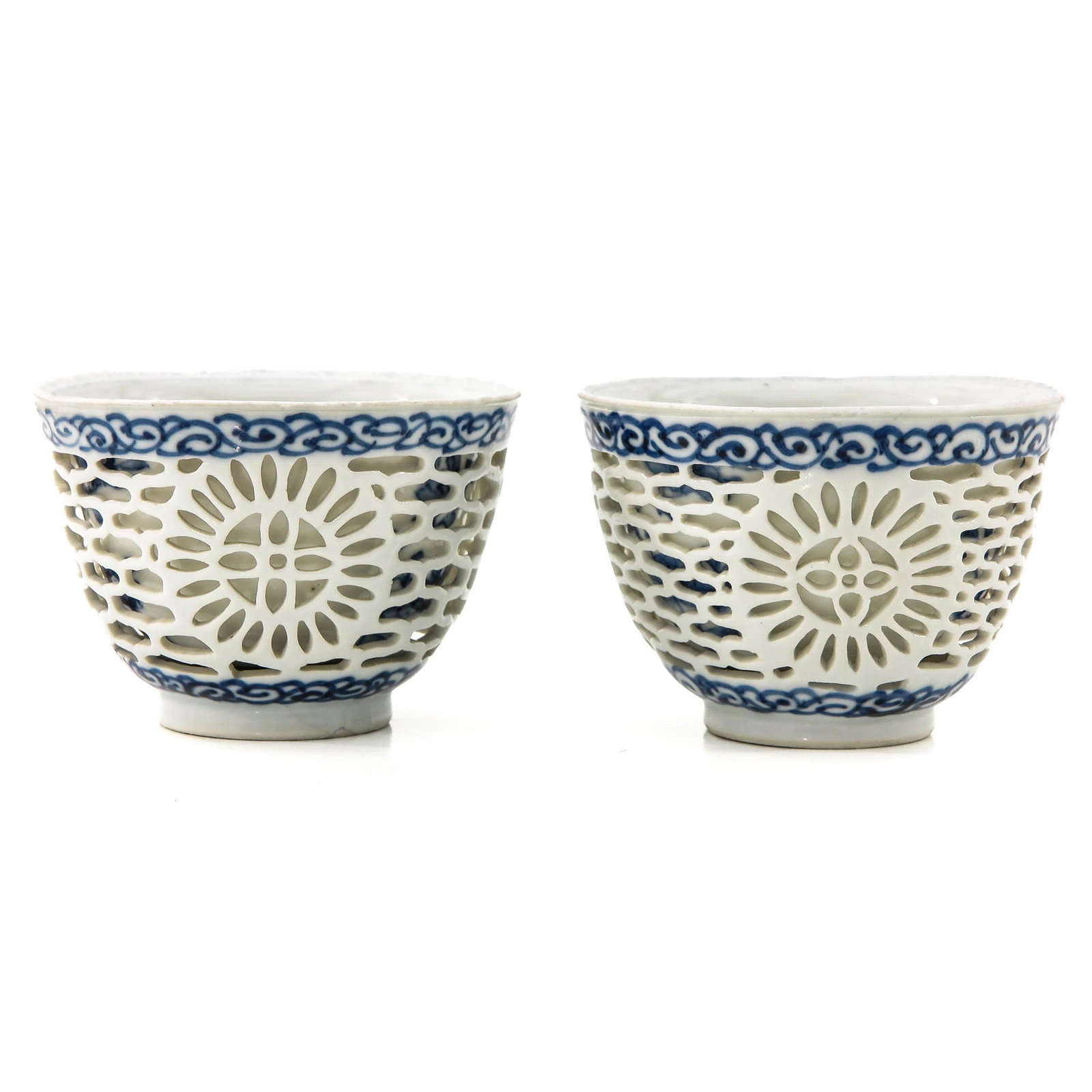 A Pair of Ling Long Bowls: Kangxi period, 8 cm. in diameter, hairline.