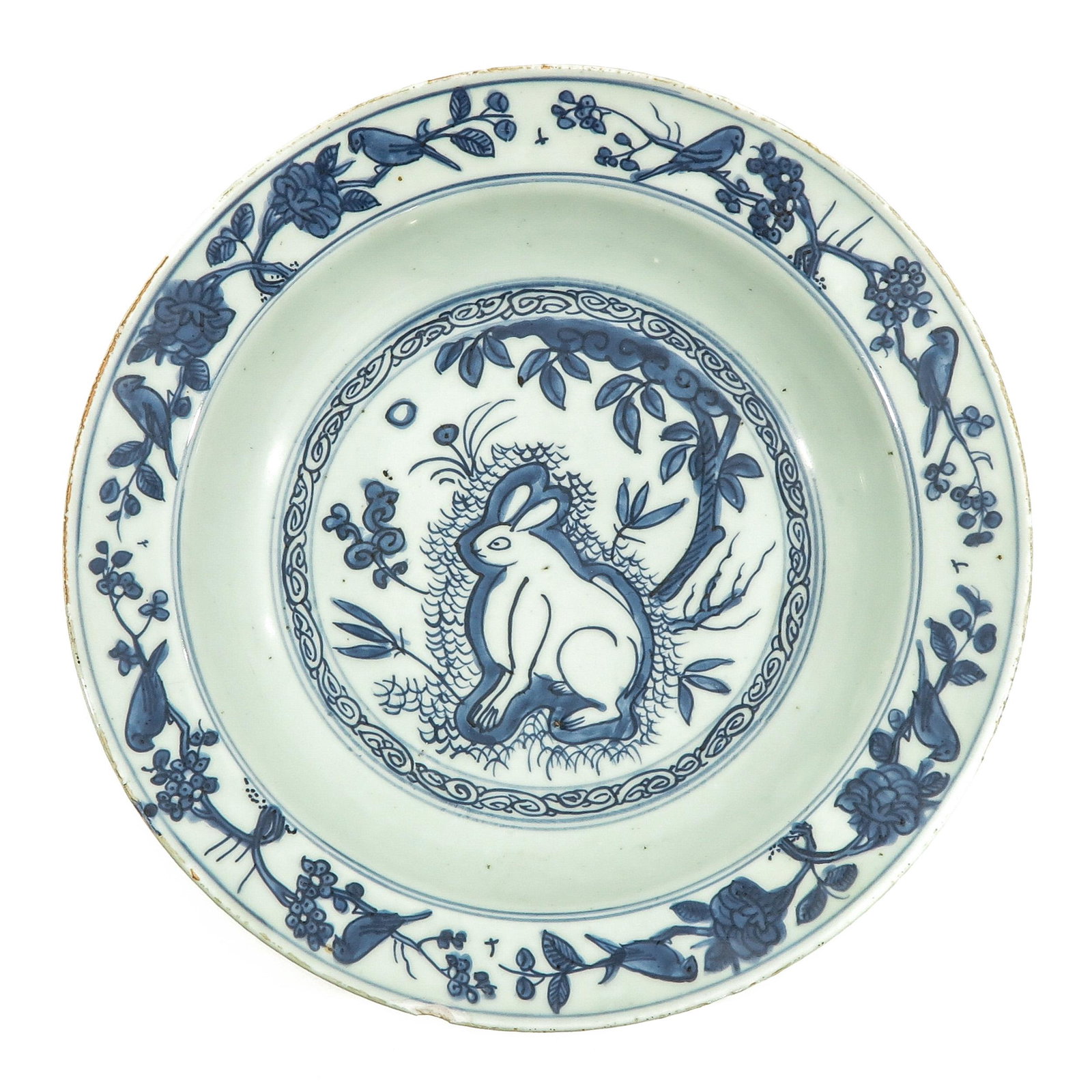 A Blue and White Bowl: Depicting rabbit in center of bowl with flowers on border, 31 cm. in diameter, chip on edge.