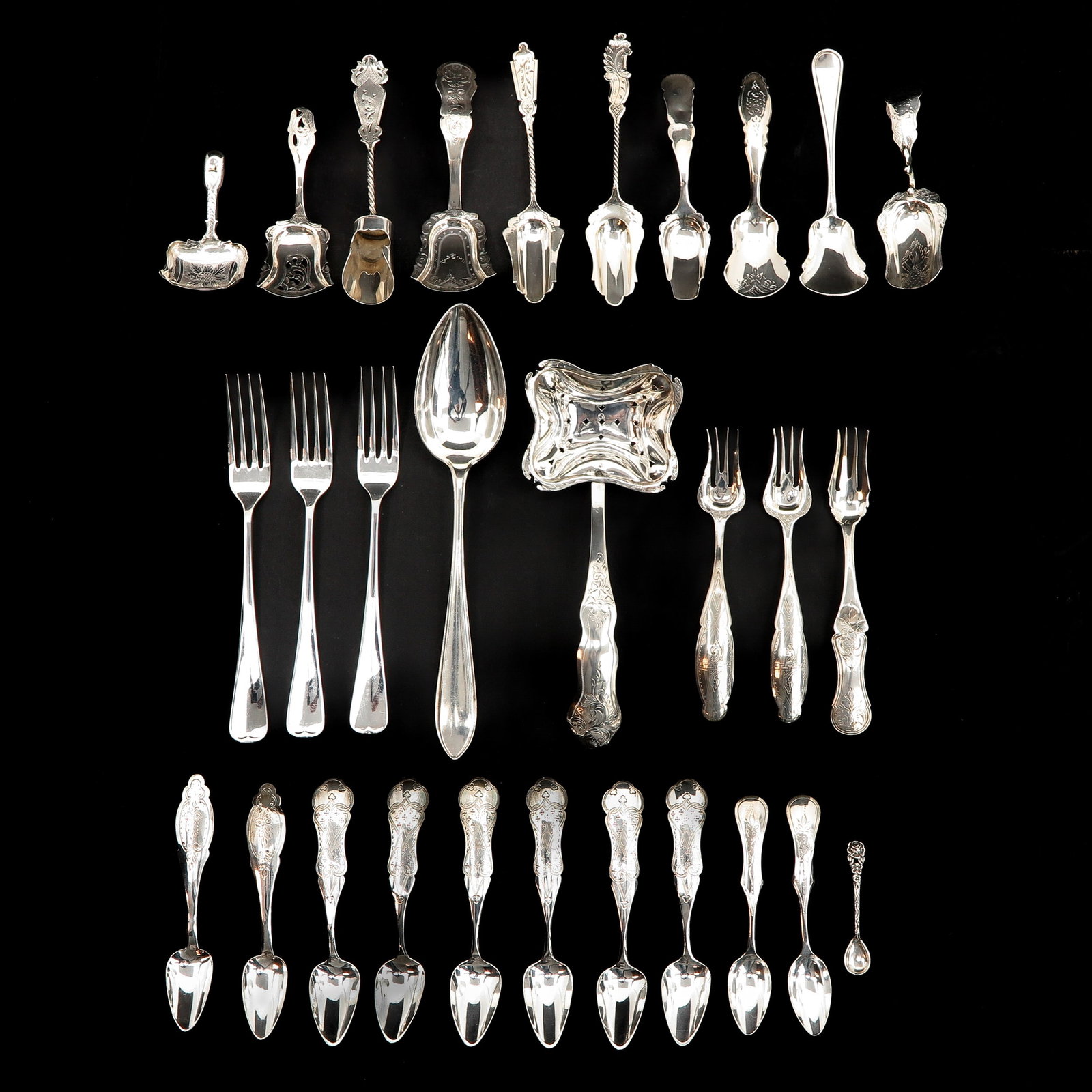 A Collection of Silver Cutlery: Including tea thumb spoon.