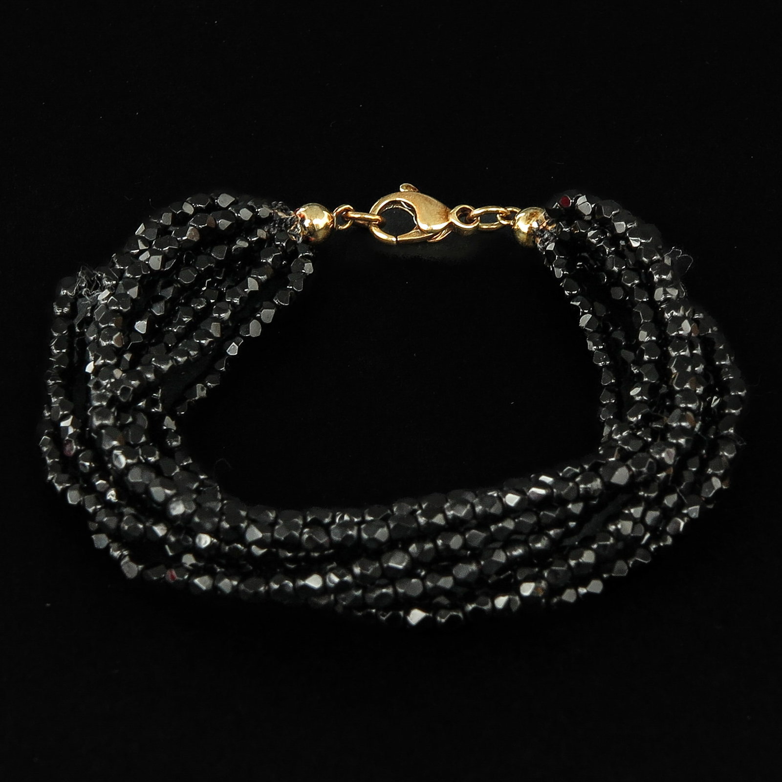 A Garnet Necklace with 14KG Clasp: 9 strands.