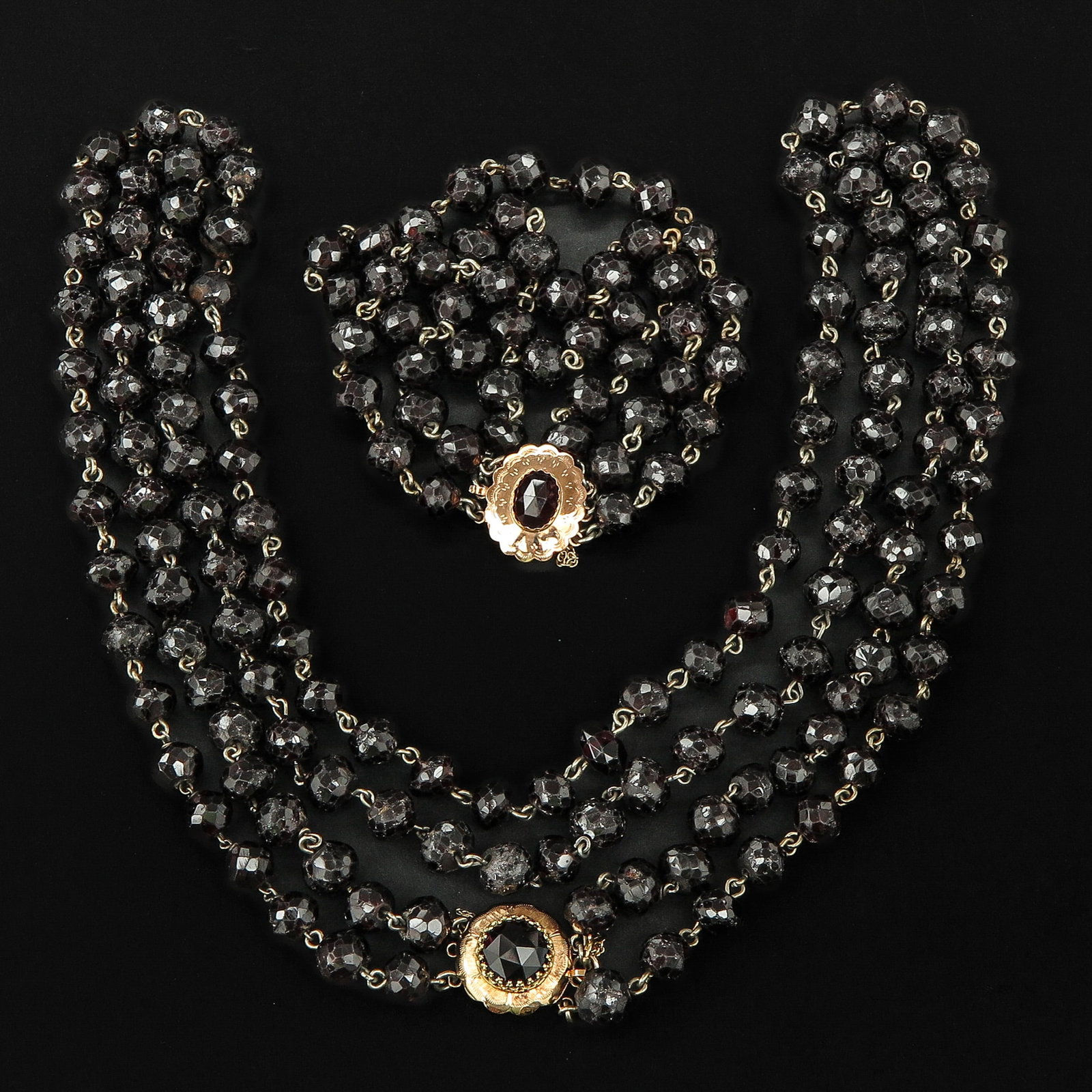 A Garnet Bracelet and Necklace: 14KG clasp.