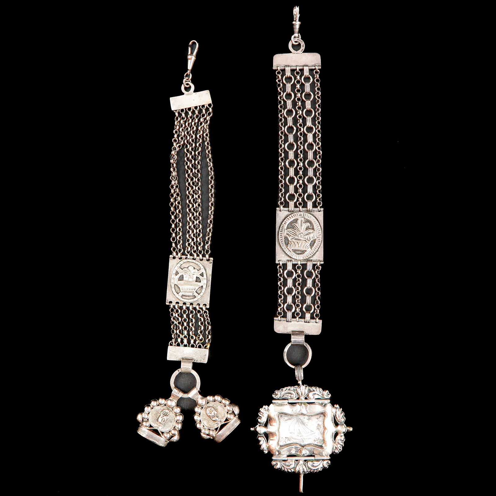 A Lot of 2 Silver Chatelaines: Including watch chain with 6 Jasseron chains and 2 signets, makers mark Theodorus Veroen, 23 cm. long.