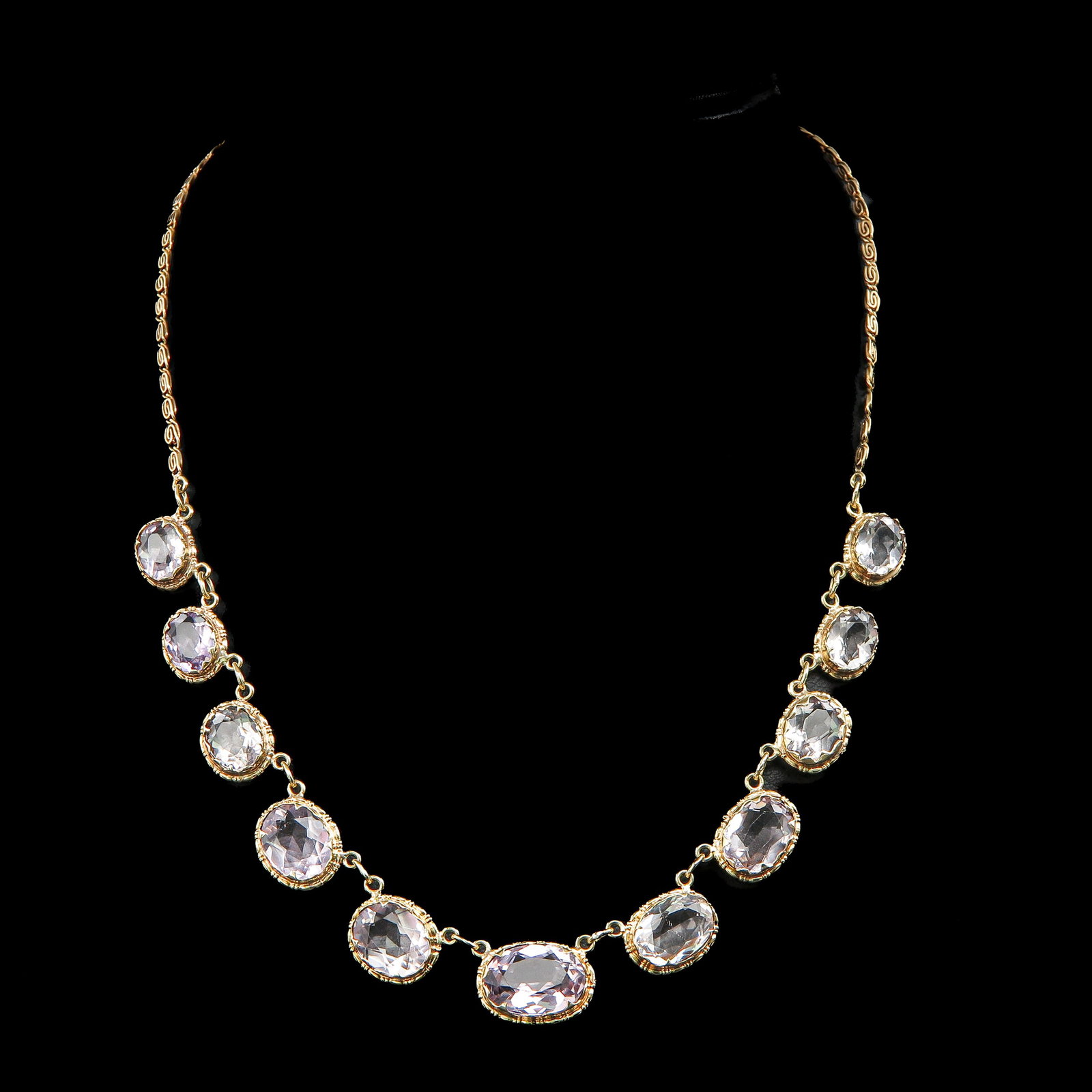 A 14KG Necklace: Set with faceted Amethyst, largest is 10 x 14 mm., 42 cm. long.