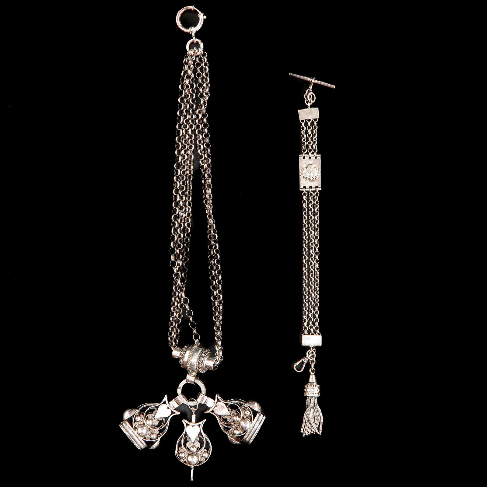 A Lot of 2 Silver Chatelaines: Including watch chain with 3 Jasseron chains, makers mark M.T.IK., 21 cm. long.