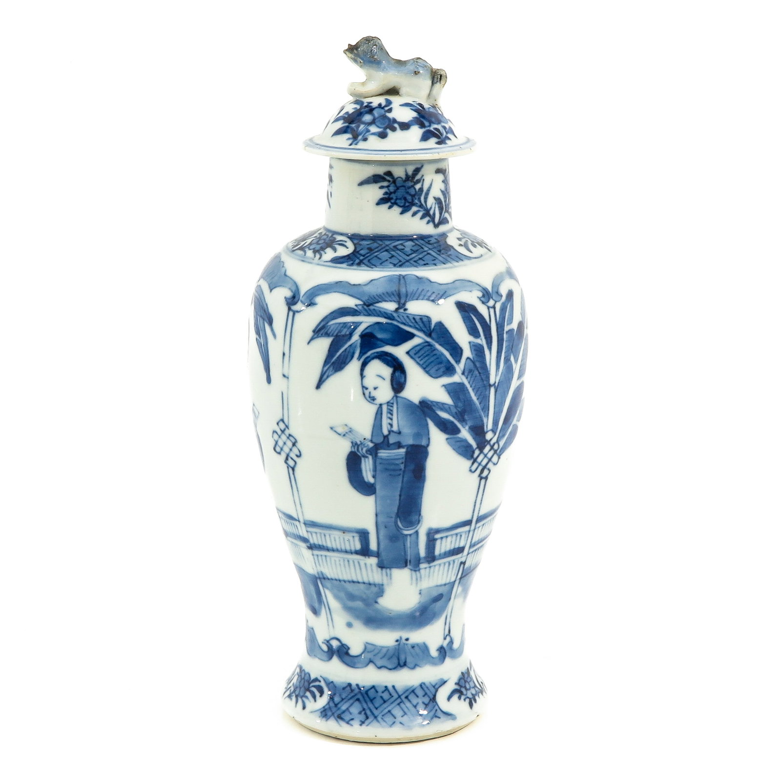 A Blue and White Garniture Vase: Decorated with Chinese ladies in garden, 27 cm. tall, chip and hairline in cover.