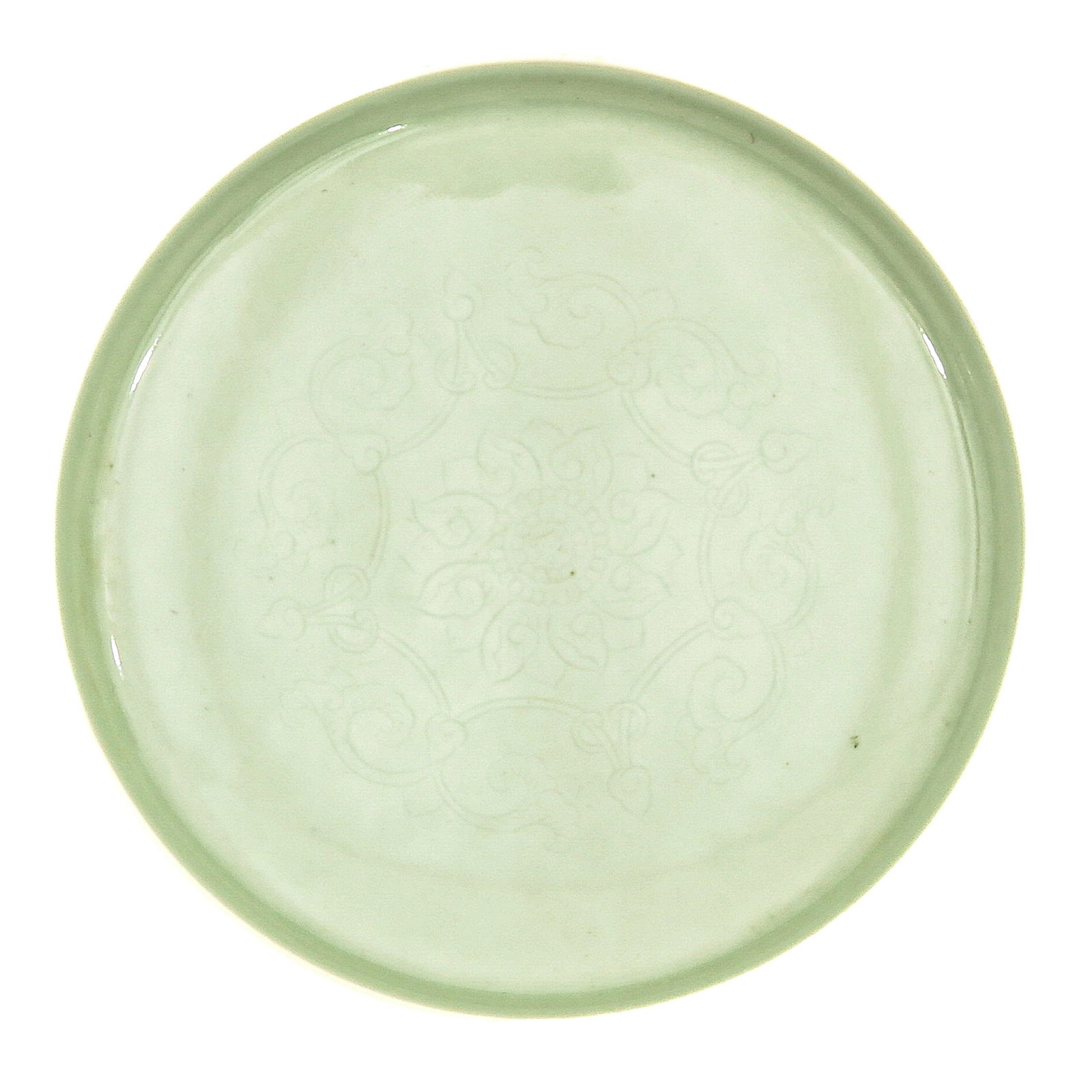 A Small Celadon Dish: On raised circular base, Yongzheng mark, 16 cm. in diameter.