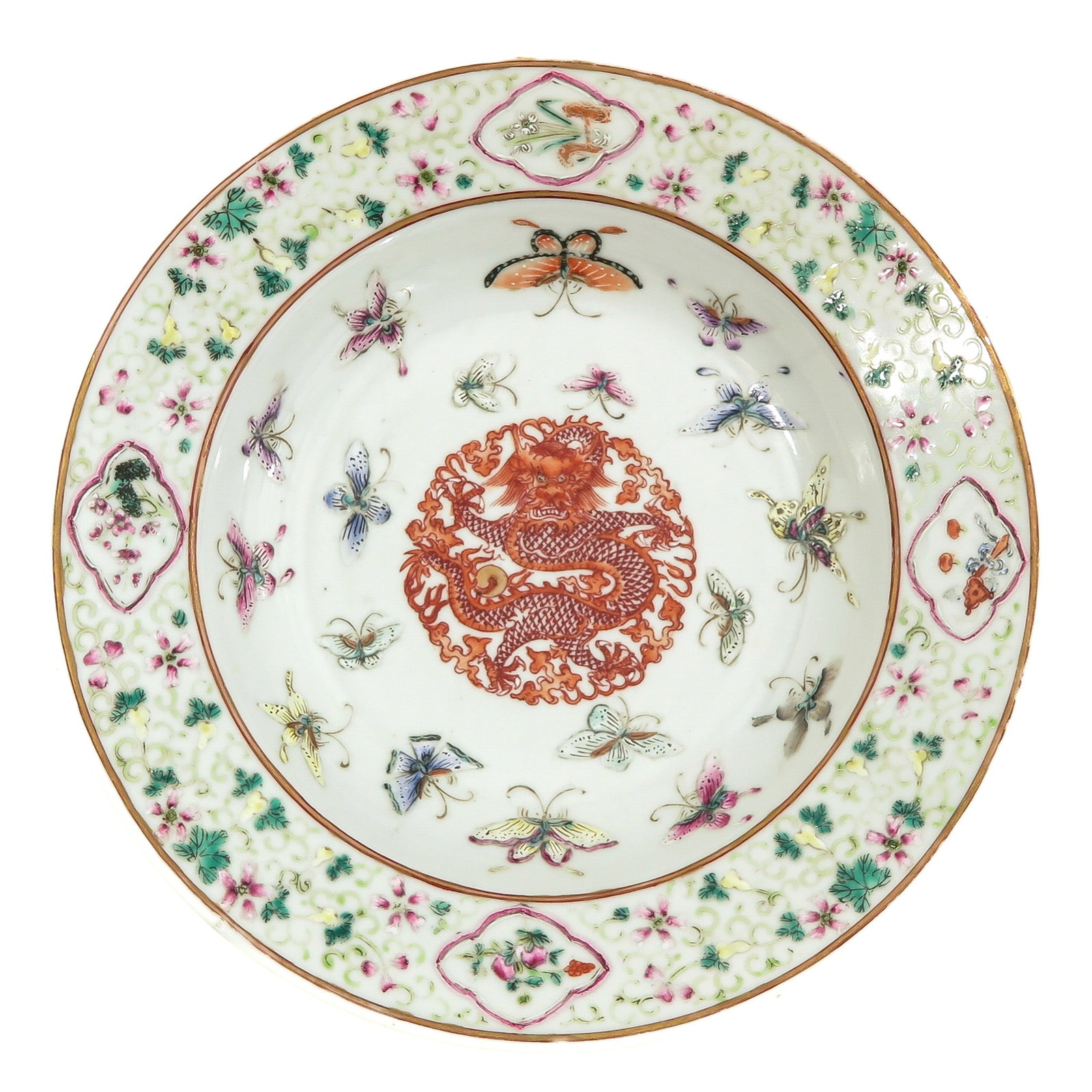 A Famille Rose Plate: Decorated with dragon in center of plate surrounded by butterflies and floral border, Guangxu mark, 23 cm. in diameter.