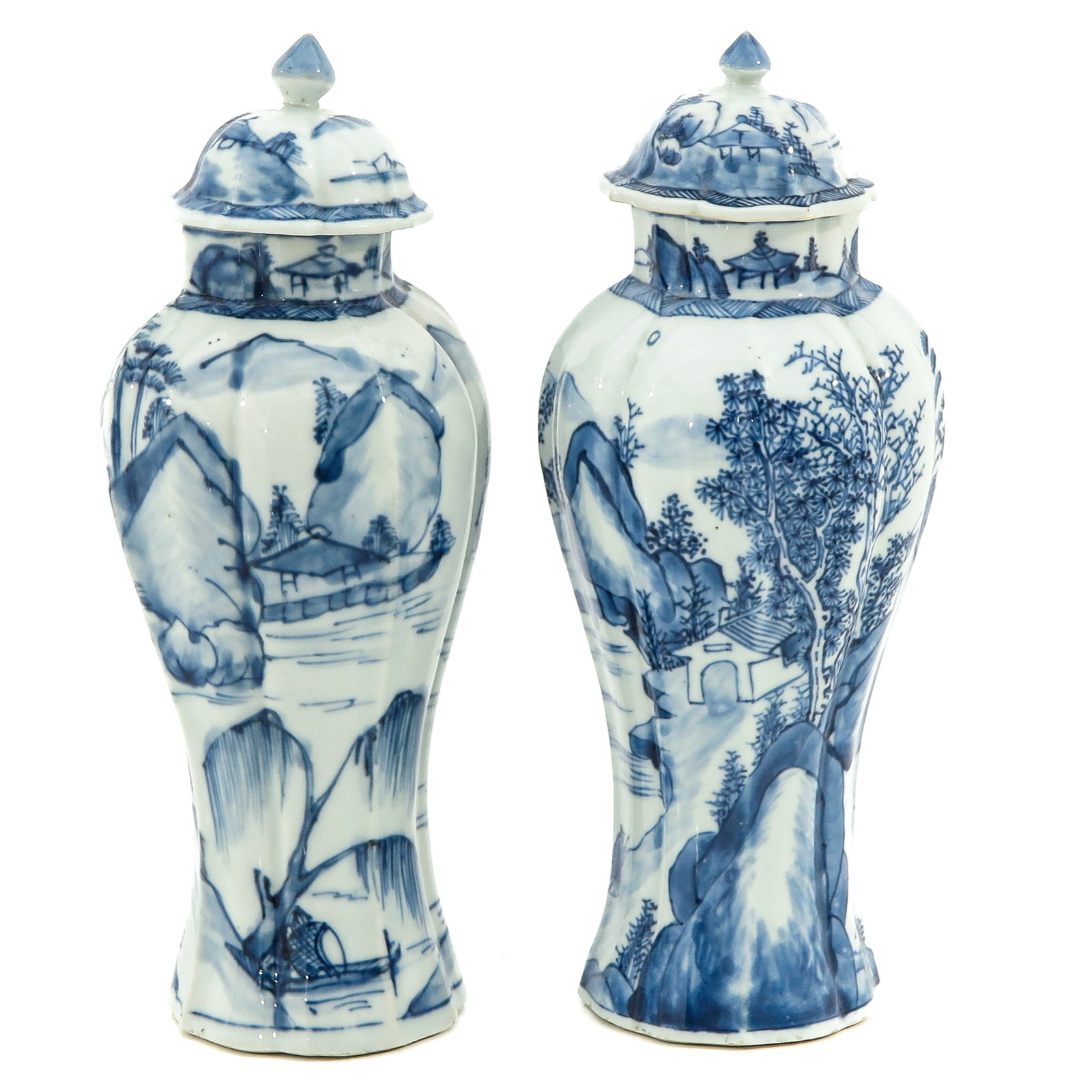 A Pair of Blue and White Garniture Vases: Landscape decor, 18th Century, 26 cm. tall, in diverse conditions.