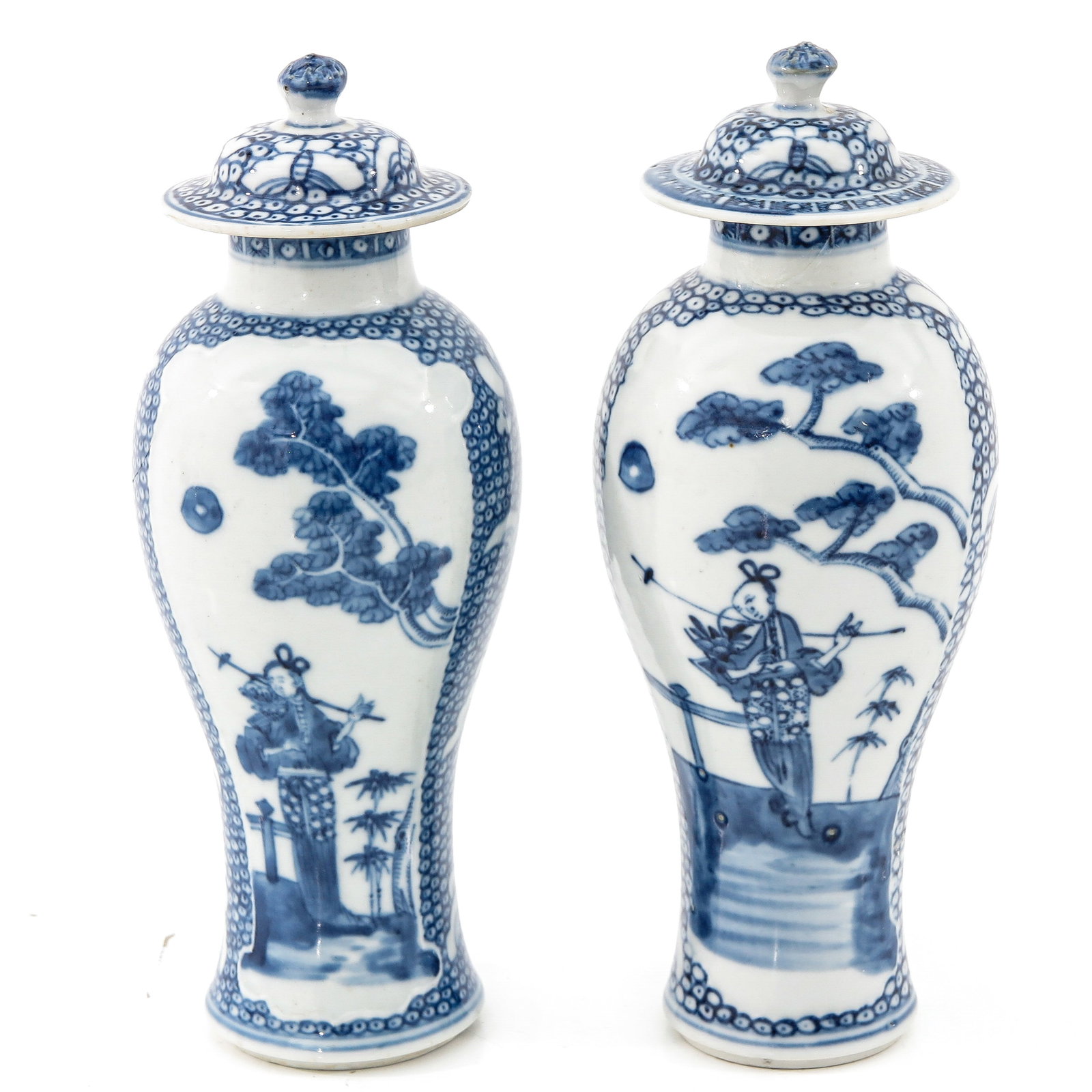 A Pair of Blue and White Garniture Vases: Depicting lady in garden holding basket of flowers, 21 cm. tall, in diverse conditions.