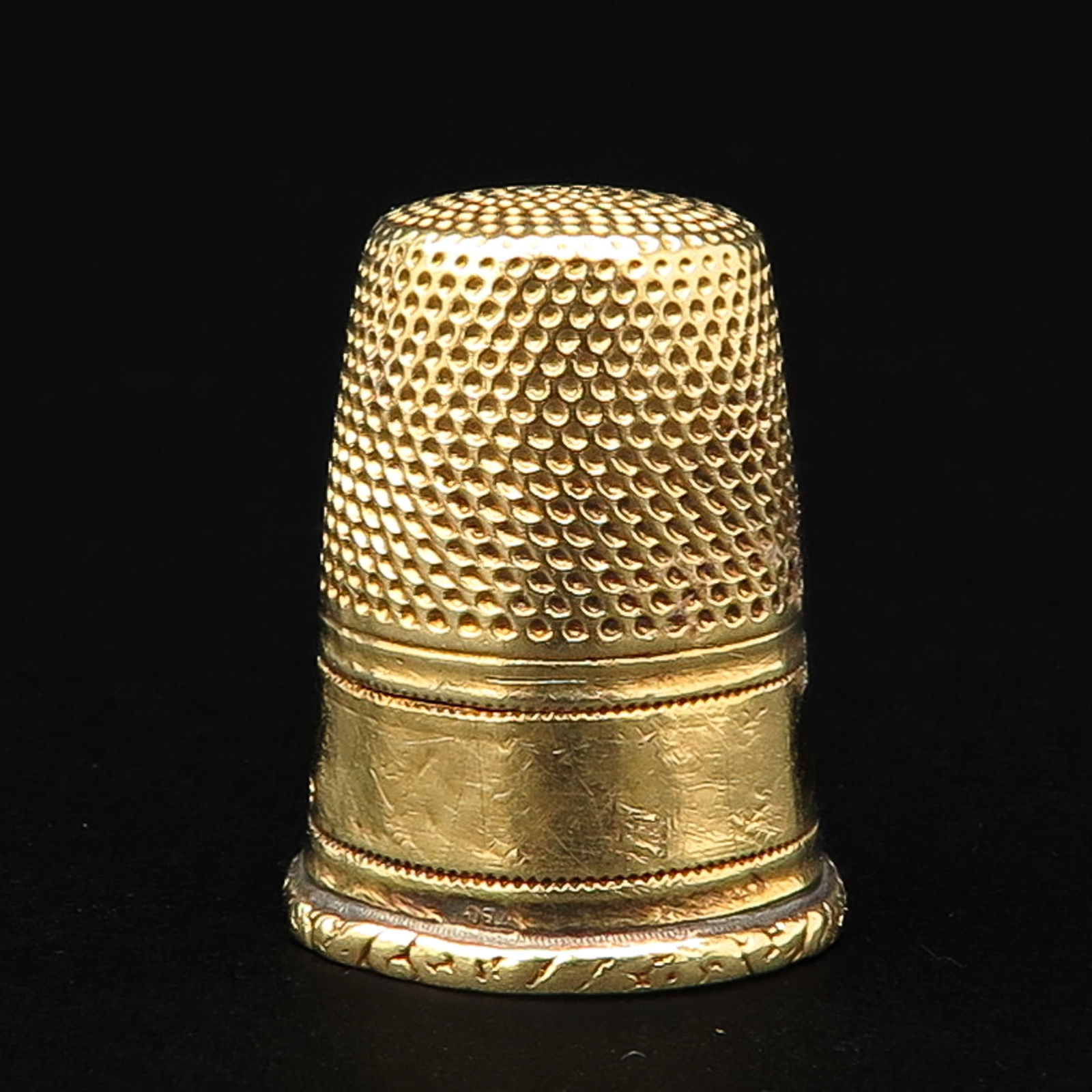 A 19th Century Gold Thimble: 18 mm. in diameter.