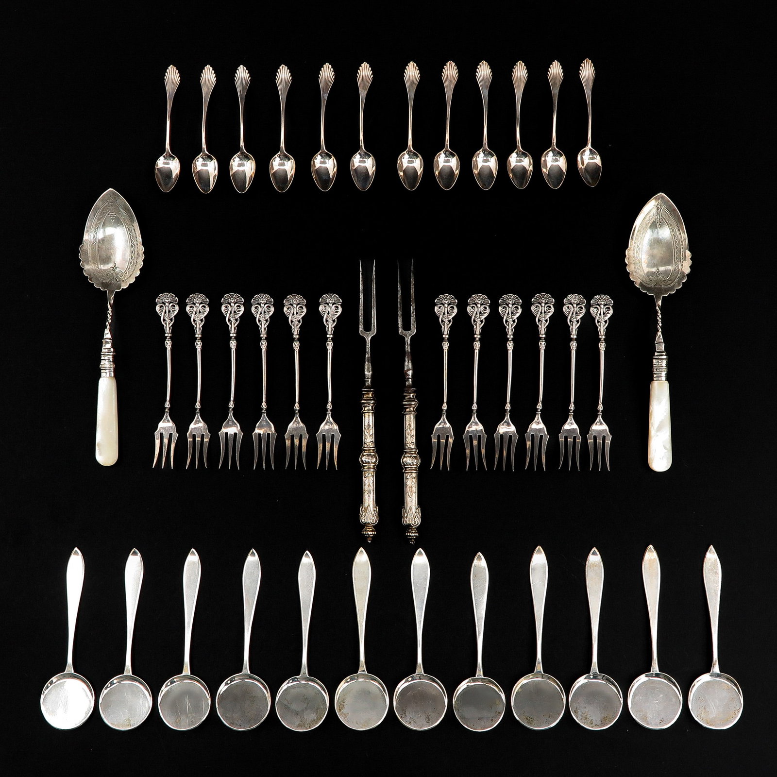 A Collection of Cutlery: Consisting of 5 cassettes, including 12 Mocca spoons, maker's mark Van Kempen, length 89 mm.