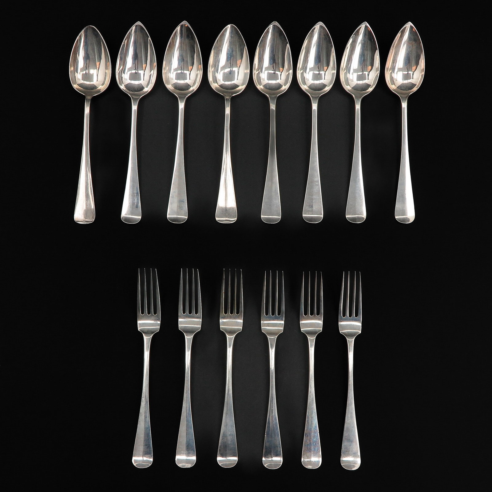 A Collection of 14 Pieces of Silver Cutlery: 835/1000 silver, marked VH8, 21 cm. long.