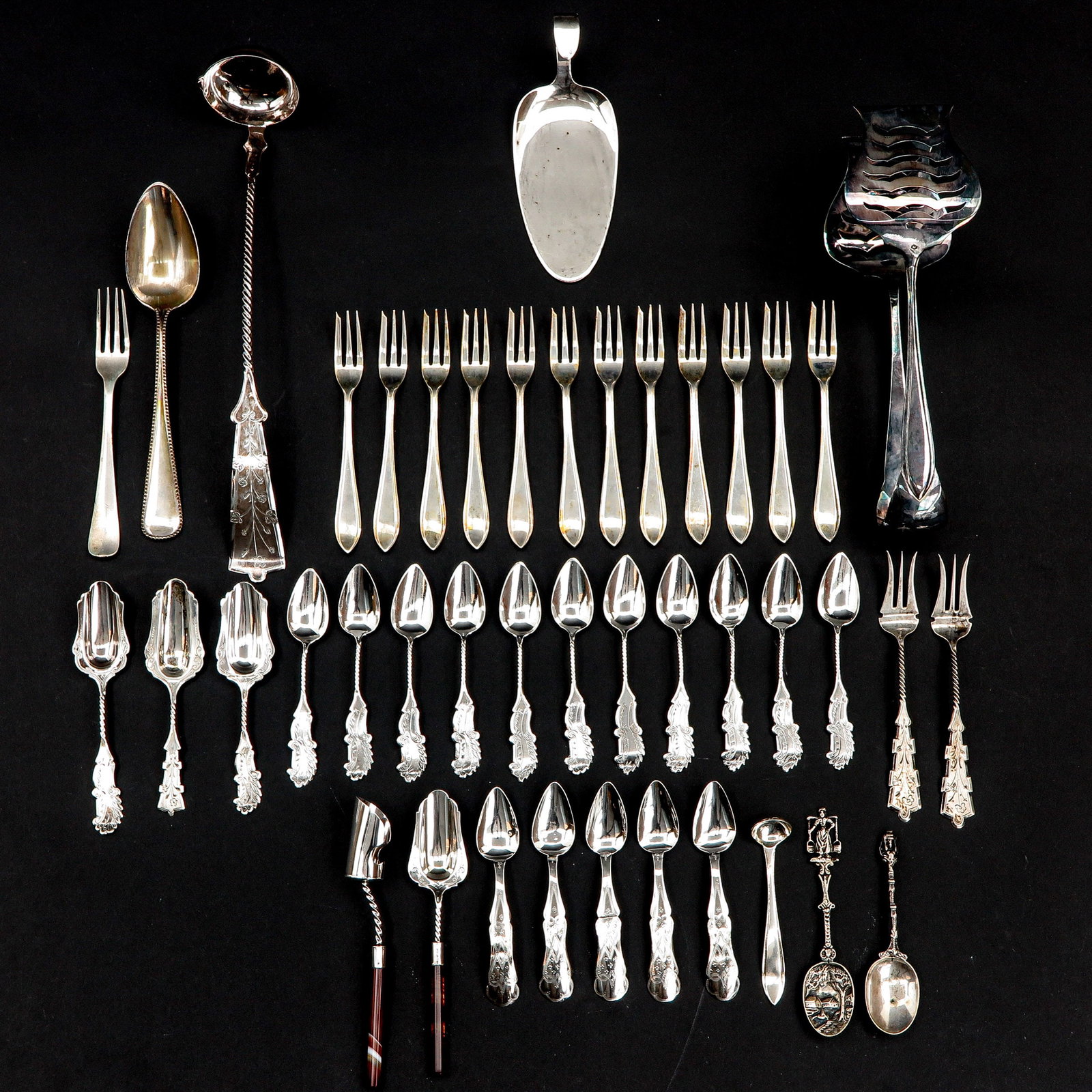 A Collection of Items: Including diverse silver cutlery.