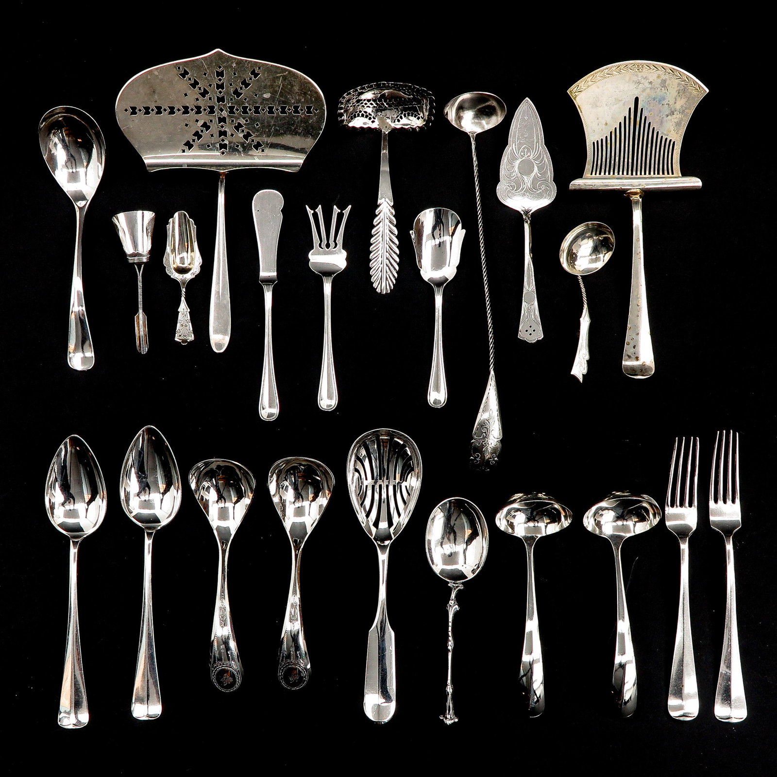 A Diverse Collection of Cutlery: Including silver pastry server.