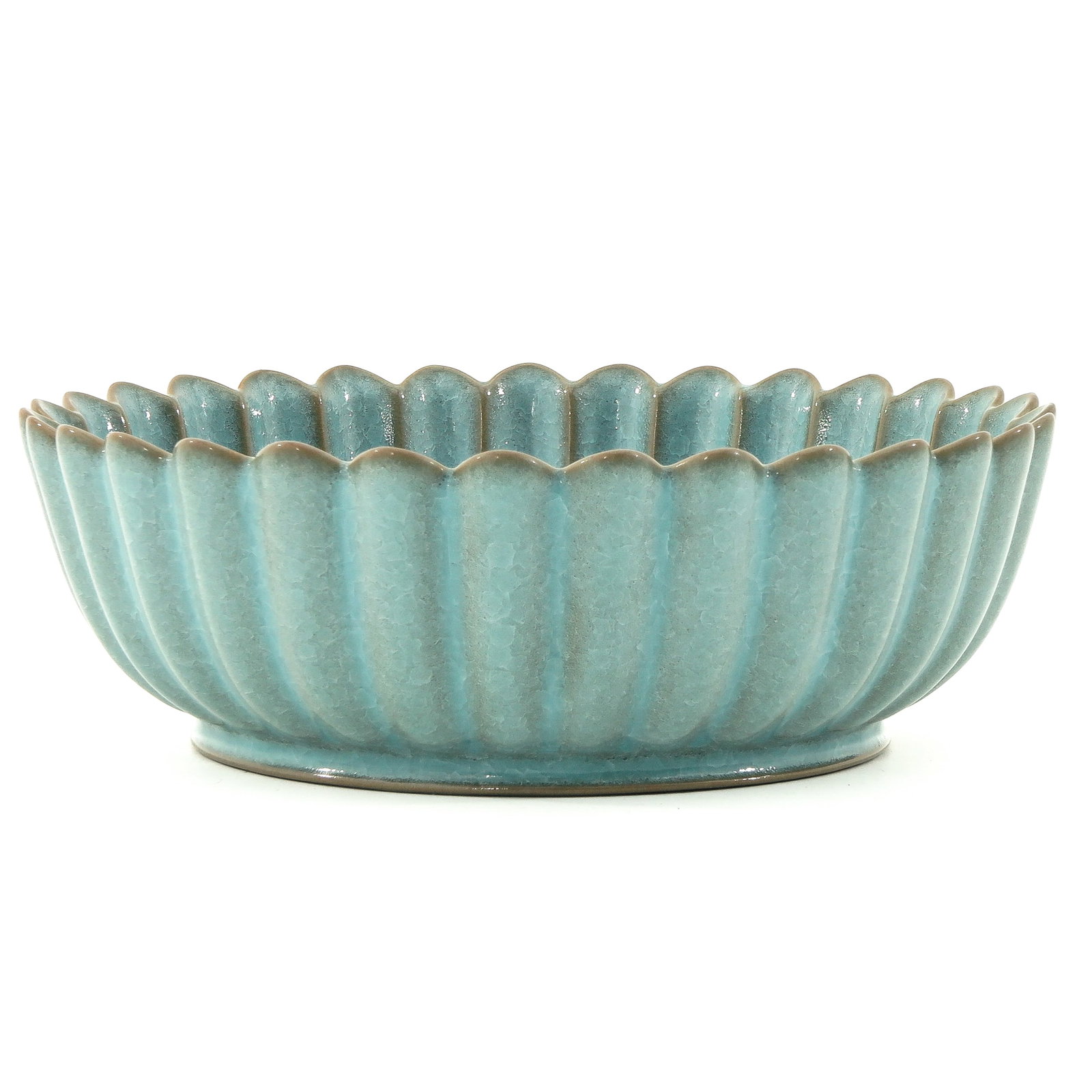 A Blue Glazed Dish: Decorated with Chinese text on bottom of dish, 22 cm. in diameter.