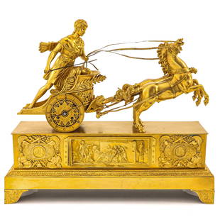 A French Pendule: France, Empire, ormolu, depicting a Roman on chariot, height 47 cm.