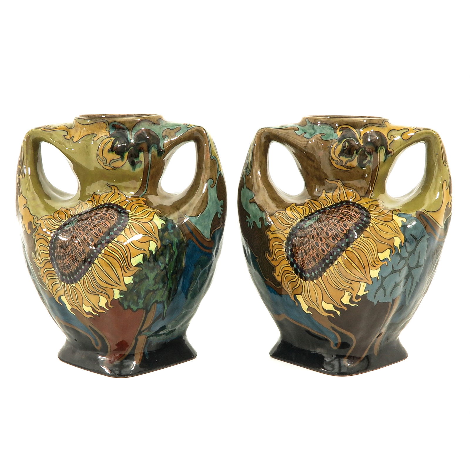 A Pair of Rozenburg Vases: decorative vases, pottery, marked Rozenburg The Hague, painted with sunflowers, height 24 cm., both bottoms are restored.