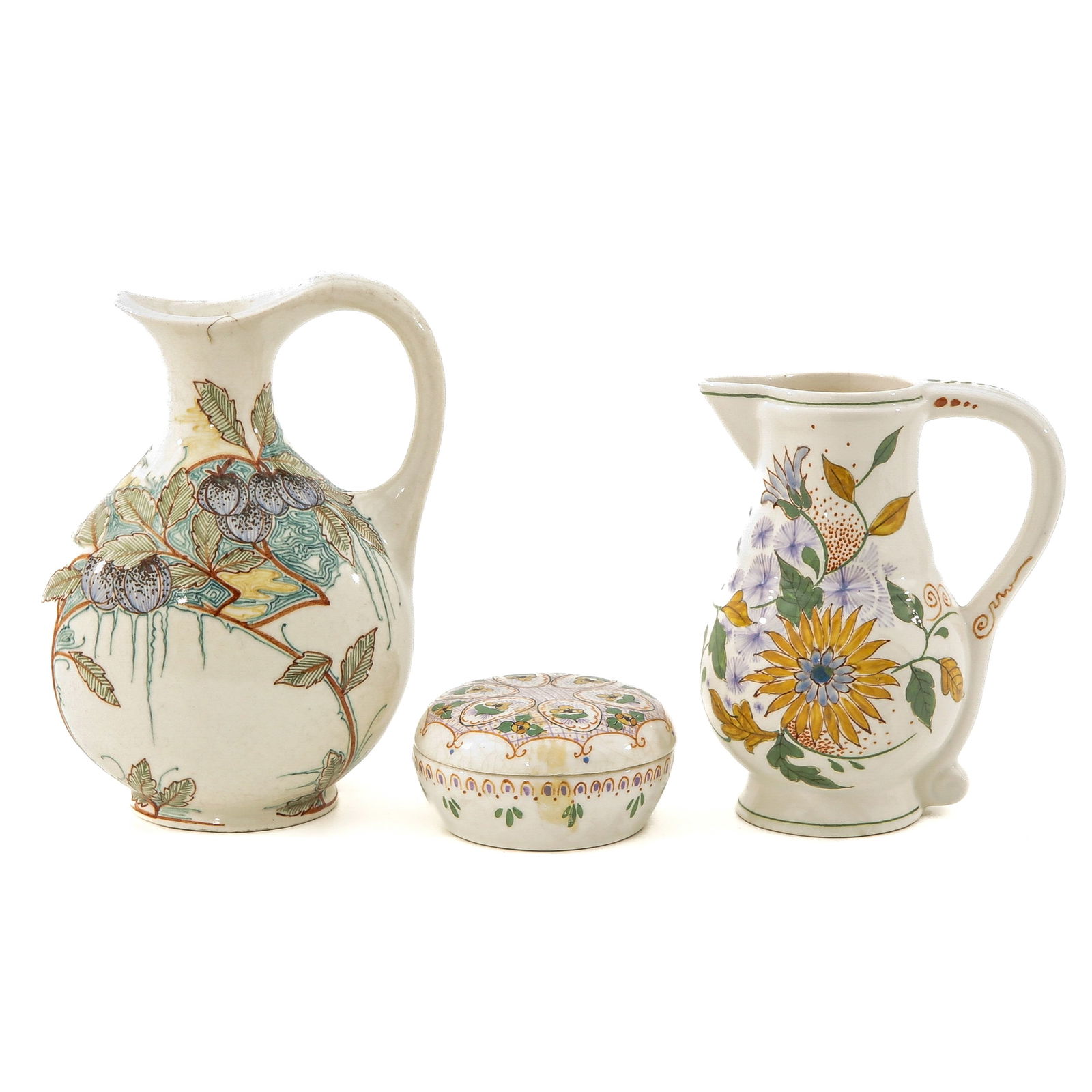 A Collection of Pottery: consisting of 3 pieces of white earthenware, marked Zuid Holland, Gouda, including a lidded box, decor Helene, highest 17 cm.