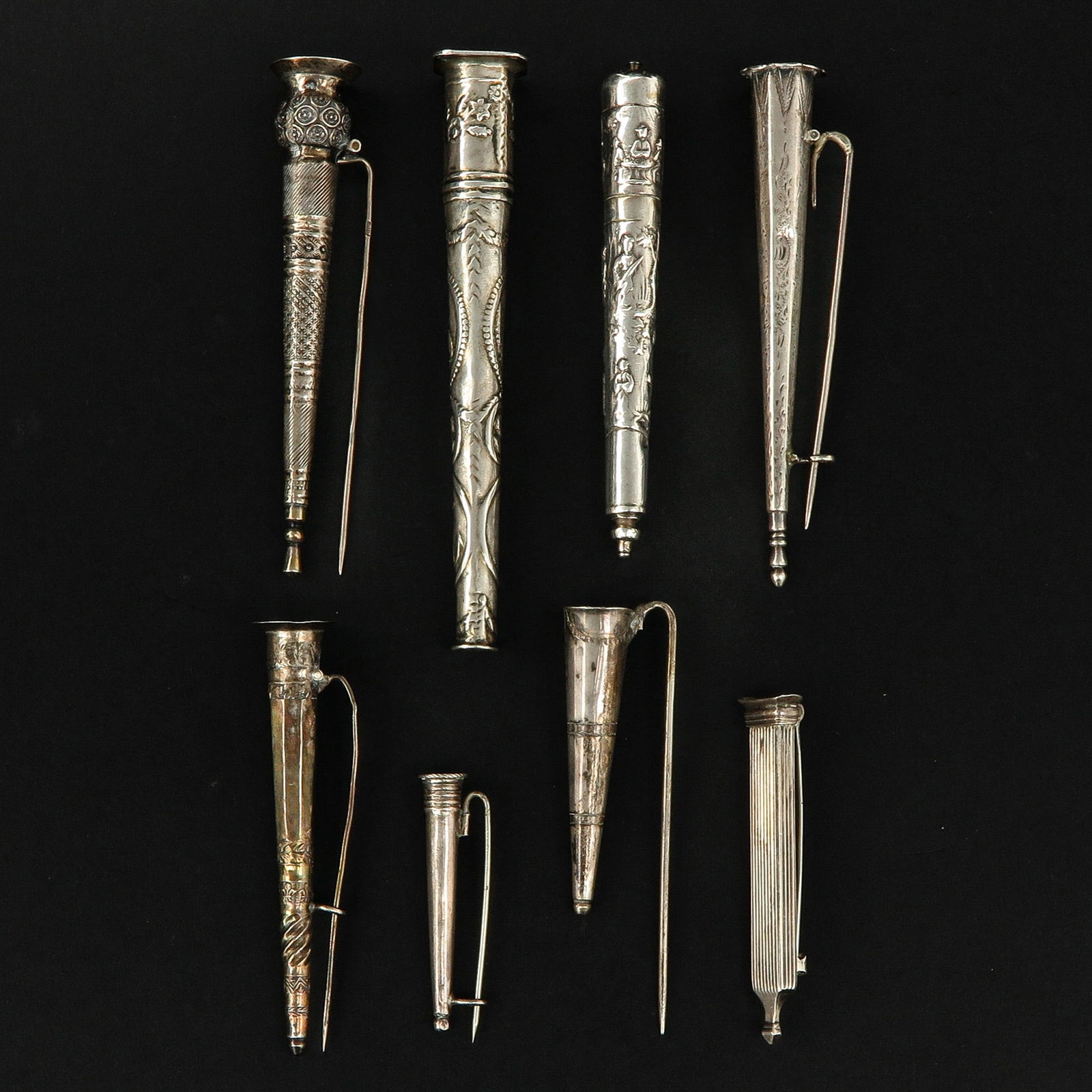 A Collection of Silver Items: consisting of 8 pieces of silver, including 18th century needle cases, Amsterdam, longest 105 mm.