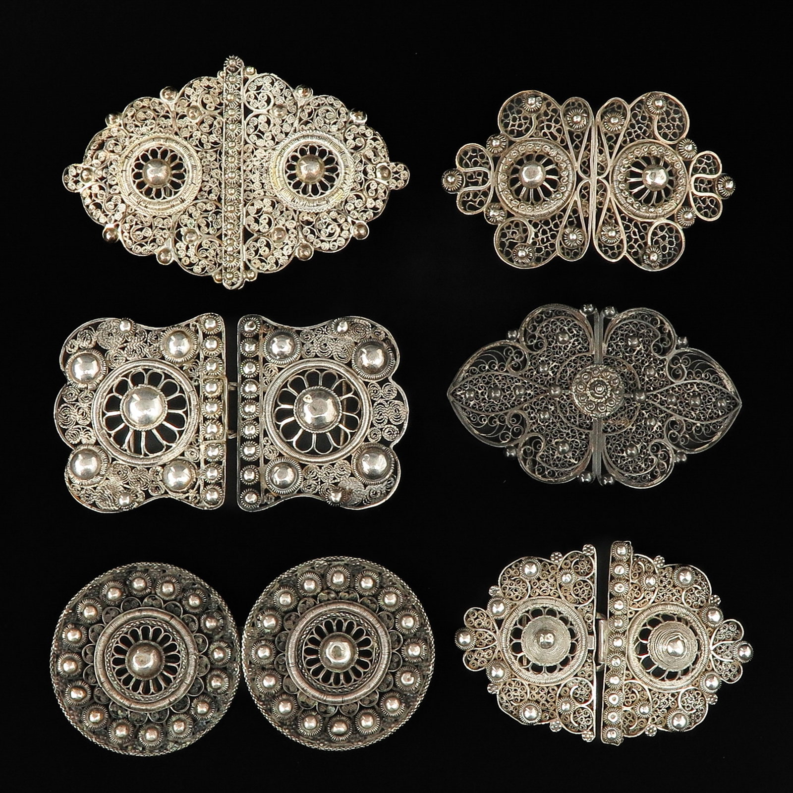 A Collection of Silver Buckles: Consisting of 6 pieces of silver buckles from the regional costume, including Zeeland, widest 11 cm.