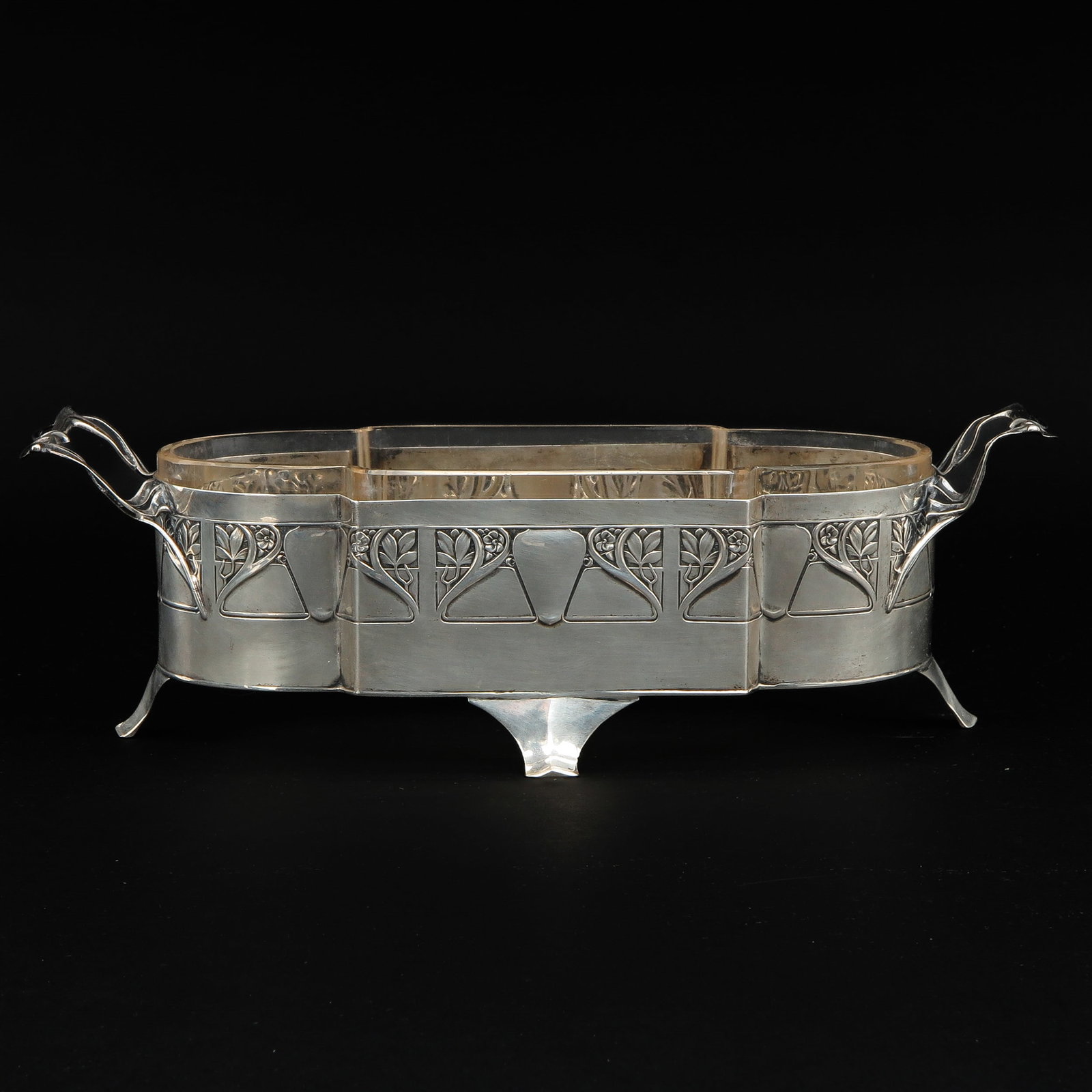 A Silver Jardinaire: 800/1000 silver, Art Nouveau, with glass inner container, length 27 cm.