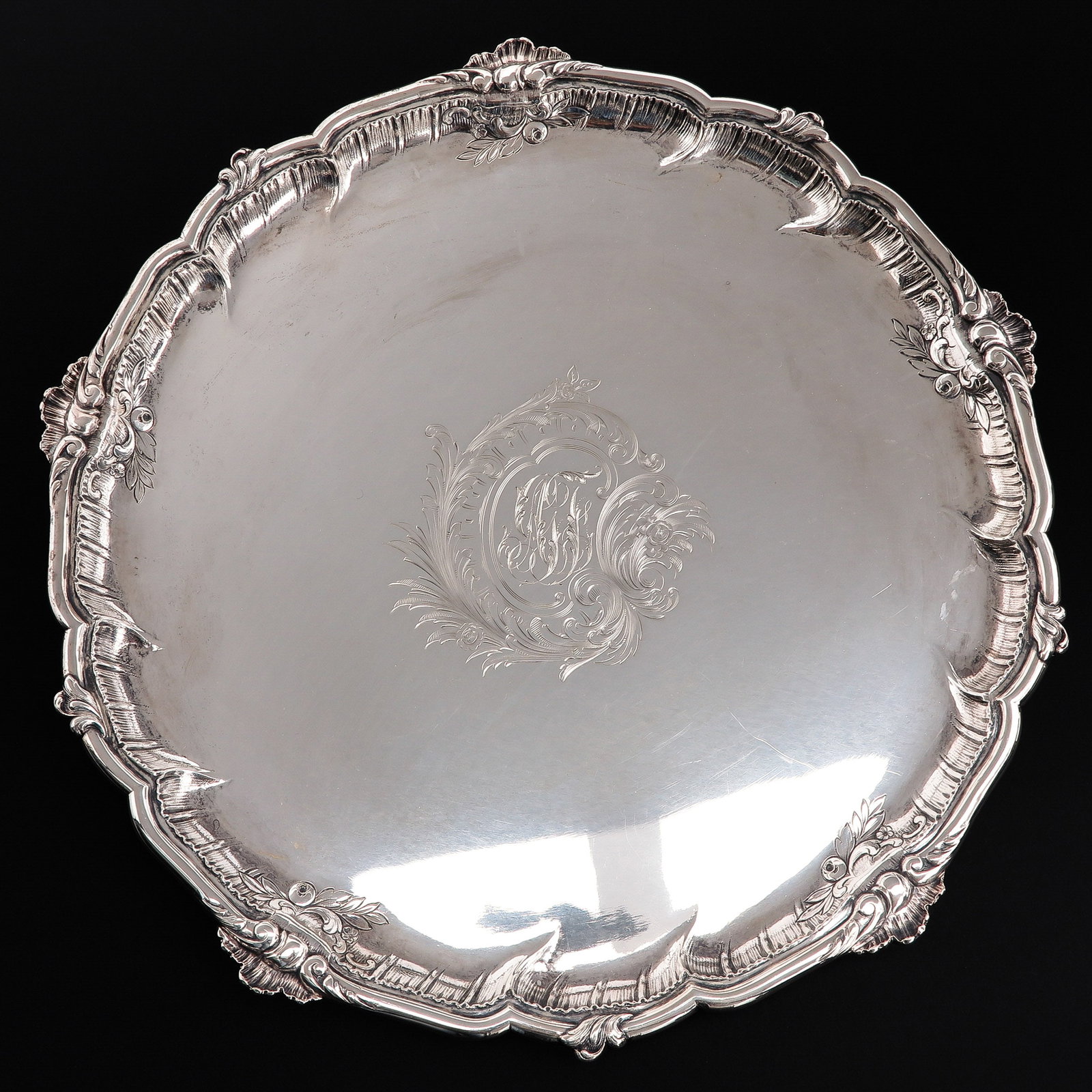 A Silver Tray: 800/1000 silver, marked C. Becker, diameter 37 cm.