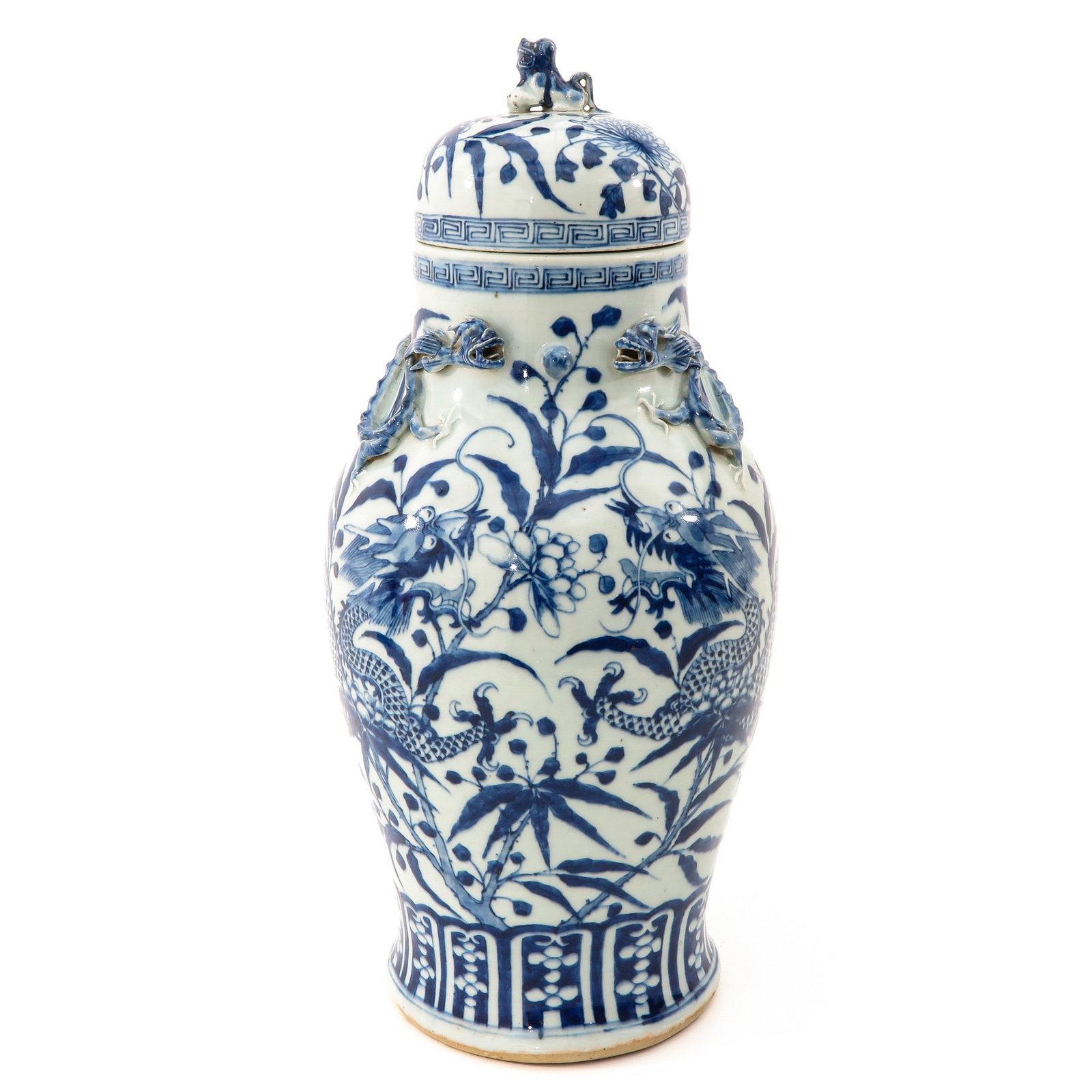 A Blue and White Vase with Cover: Floral and dragon decor, temple lion on cover, 47 cm. tall, hairline in vase, lion is glued on cover.